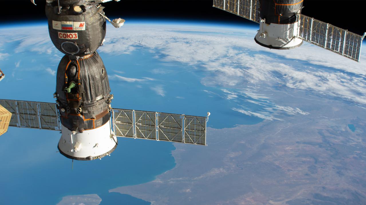 iss064e042043 (March 12, 2021) --- Two Russian spacecraft are seen docked to the International Space Station as it orbited 269 miles above southern Argentina. At left, is the Soyuz MS-17 crew ship that will soon undock from the Rassvet module and relocate to the Poisk module making room for three new crew members due to launch April 9 aboard the Soyuz MS-18 crew ship. At right, is the aft end of the Progress 77 cargo craft docked to the Pirs docking compartment.