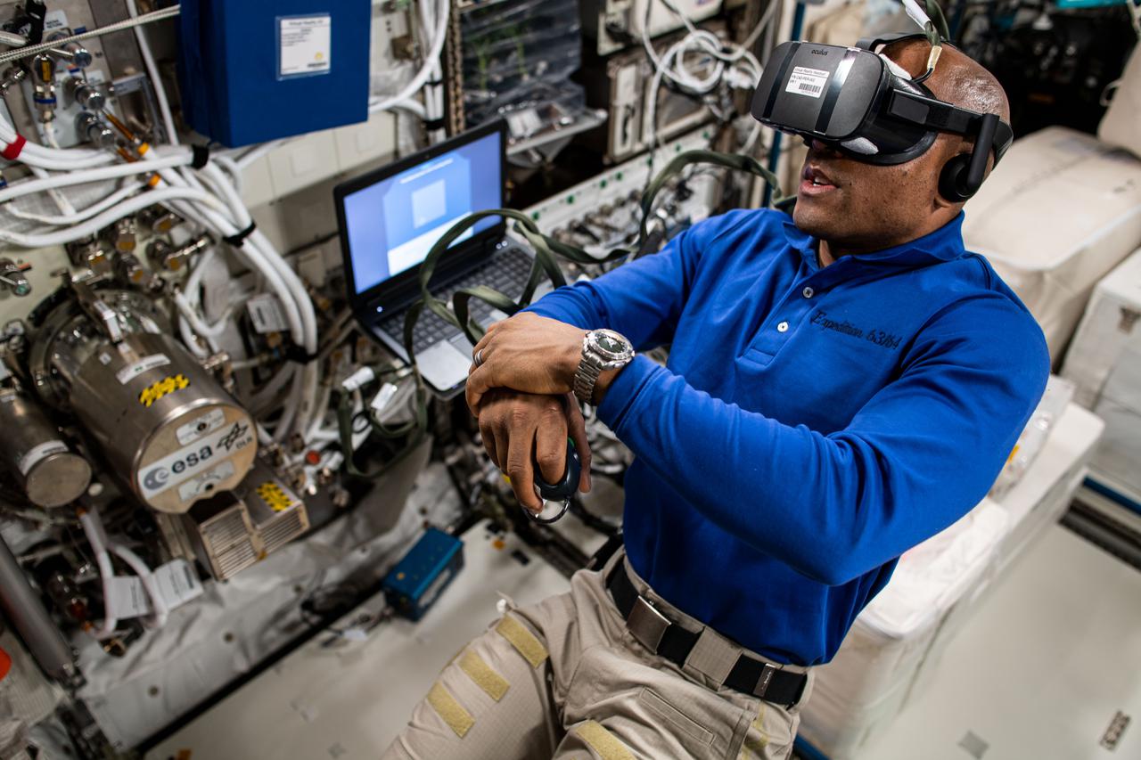 This ESA (European Space Agency) Time Perception in Microgravity investigation is studying crew member reaction times and time perception in space. Glover participates as a research subject using a virtual reality headset. This work helps provide data on astronaut cognitive performance, a critical factor for ensuring crew safety and mission success.