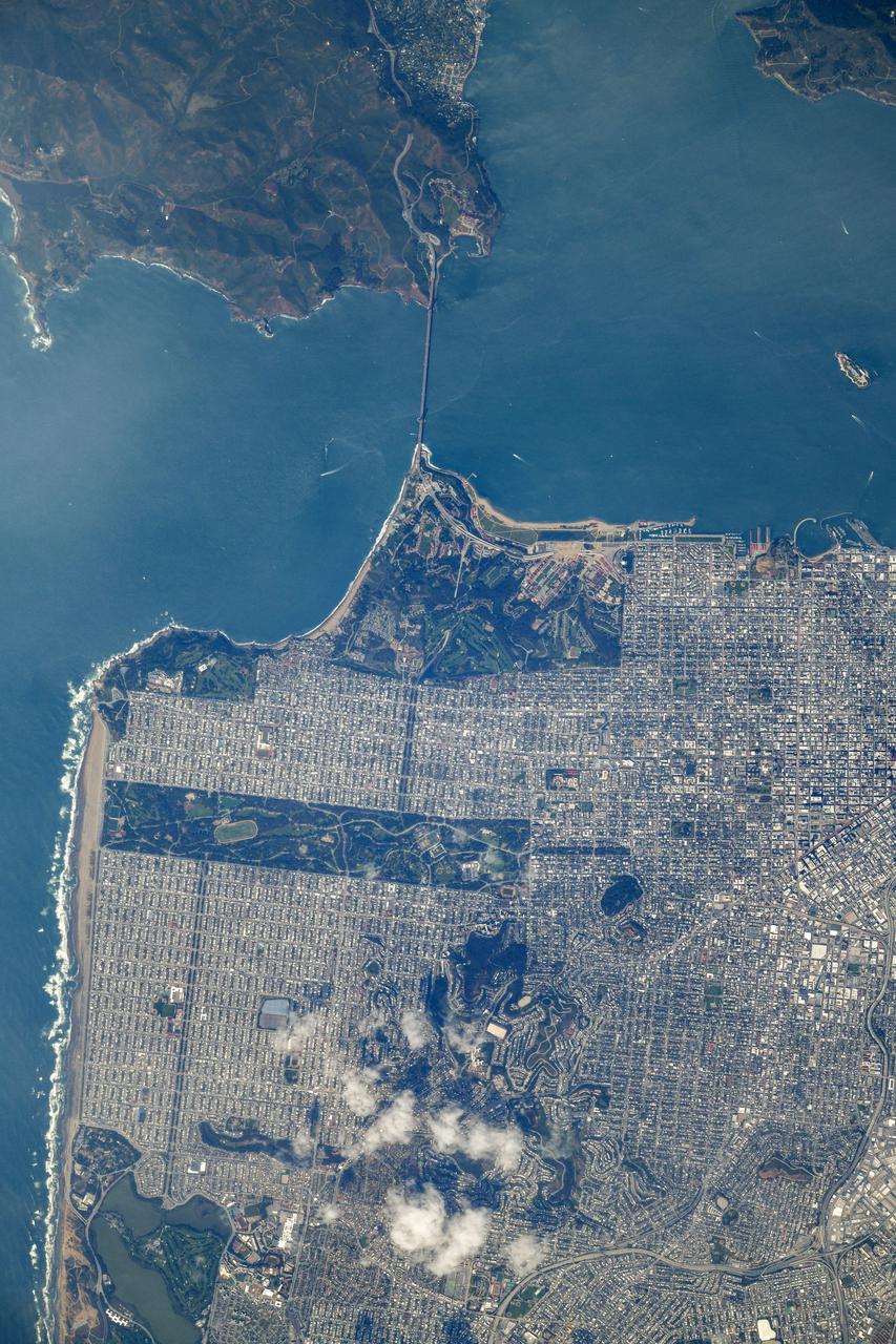 iss064e053178 (April 4, 2021) --- The Golden Gate Bridge links San Francisco with the Golden Gate National Recreation Area in northern California. The International Space Station was orbiting 264 miles above the Pacific Ocean just off the coast when this photograph was taken. Credit: Roscosmos