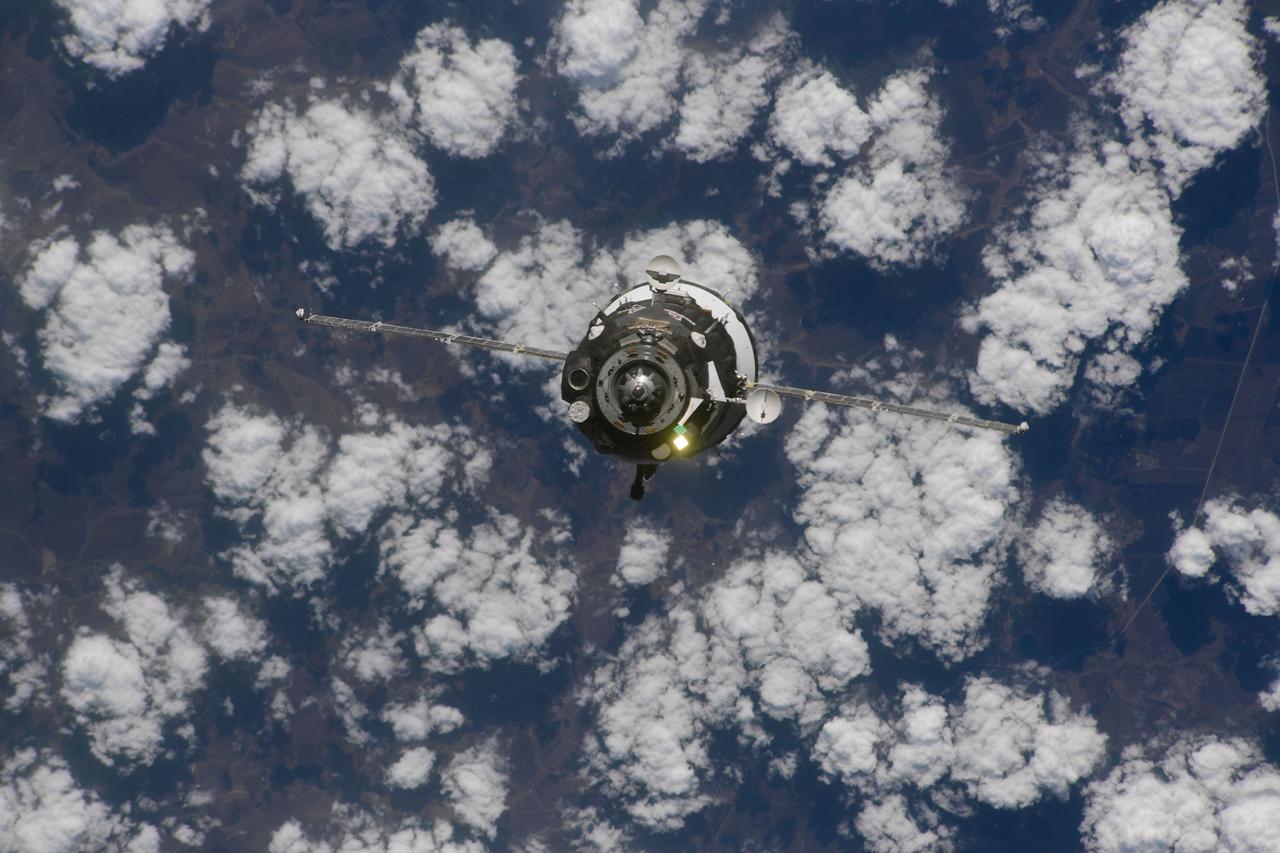 iss064e055954 (April 9, 2021) --- The Soyuz MS-18 crew ship, with three Expedition 65 crew members aboard, approaches the International Space Station 265 miles above Russia. NASA astronaut Mark Vande Hei, riding alongside Roscosmos cosmonauts Oleg Novitskiy and Pyotr Dubrov, would dock to the Rassvet module just three hours and 23 minutes after launching from the Baikonur Cosmodrome in Kazakhstan. Credit: Roscosmos