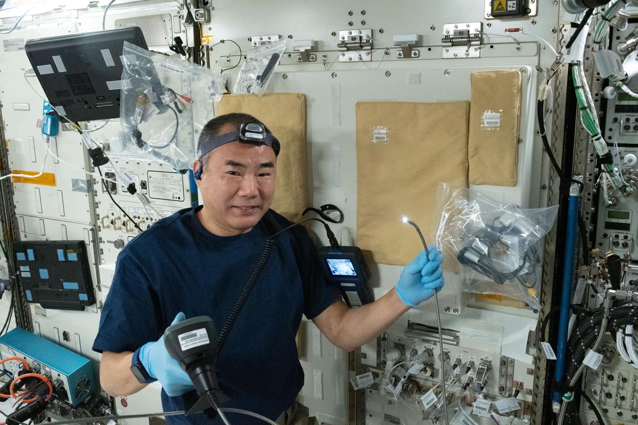 iss064e058008 (April 14, 2021) --- Expedition 64 Flight Engineer Soichi Noguchi of the Japan Aerospace Exploration Agency conducts inspection and maintenance work inside the Kibo laboratory module.
