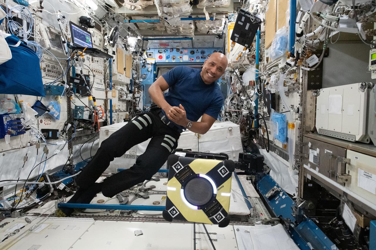 NASA astronaut and Expedition 64 Flight Engineer Victor Glover works with the Astrobee robot aboard the space station to test an adhesive for robotic grasping and manipulating as part of the Astrobee/Gecko-2 experiment. Assistive Free-Flyers with Gecko-Inspired Adhesive Appendages for Automated Logistics in Space uses the Astrobee robot aboard the space station to test an adhesive for robotic grasping and manipulating.