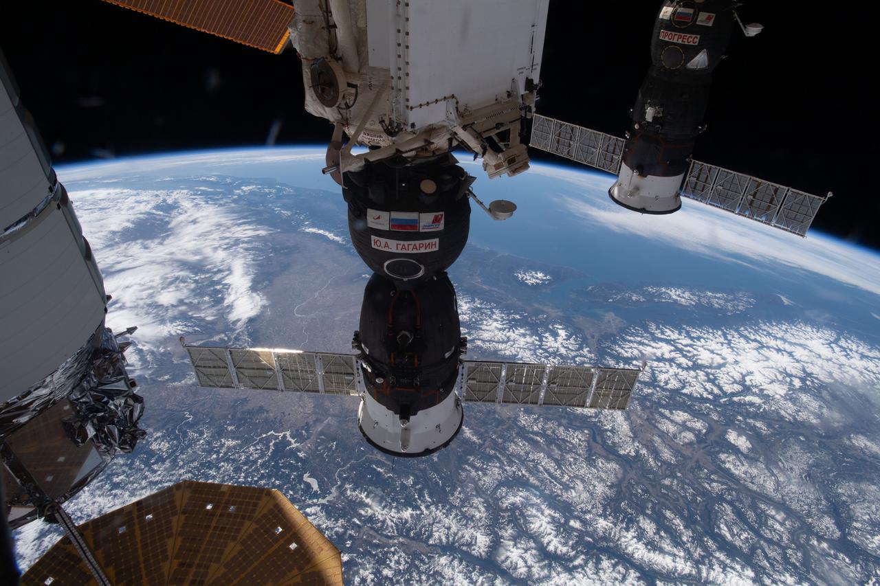 iss064e059550 (April 14, 2021) --- The Soyuz MS-18 crew ship is pictured docked to the International Space Station's Rassvet module as the orbital complex flew 265 miles above Canada near Calgary, Alberta.