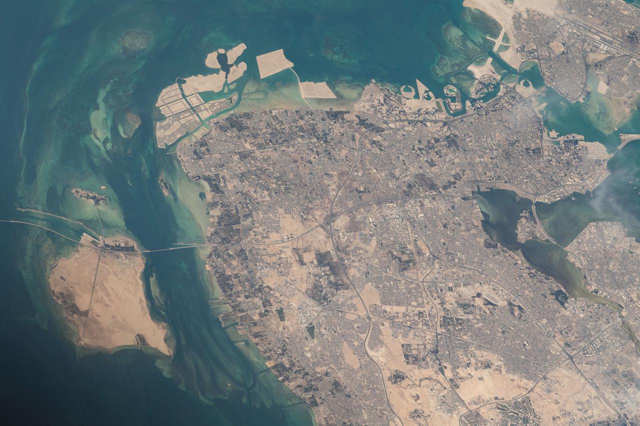 iss065e000674 (April 19, 2021) --- The north coast of the island nation of Bahrain in the Persian Gulf is pictured from the International Space Station as it orbited 262 miles above western Iran.