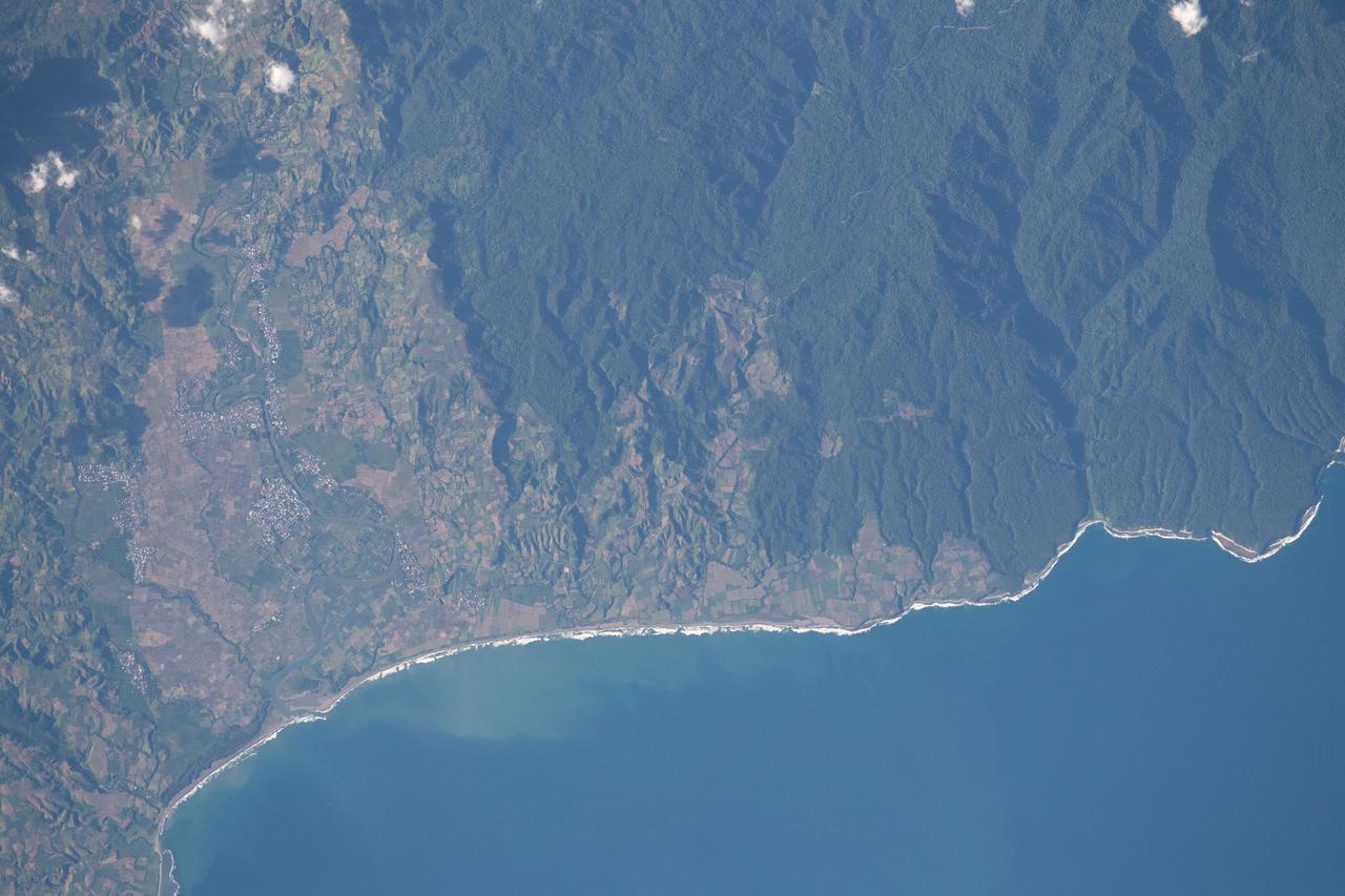 iss065e001304 (April 21, 2021) --- The south coast of West Nusa Tenggara, a province of Indonesia, is pictured from the International Space Station as it orbited 262 miles above the Indian Ocean.