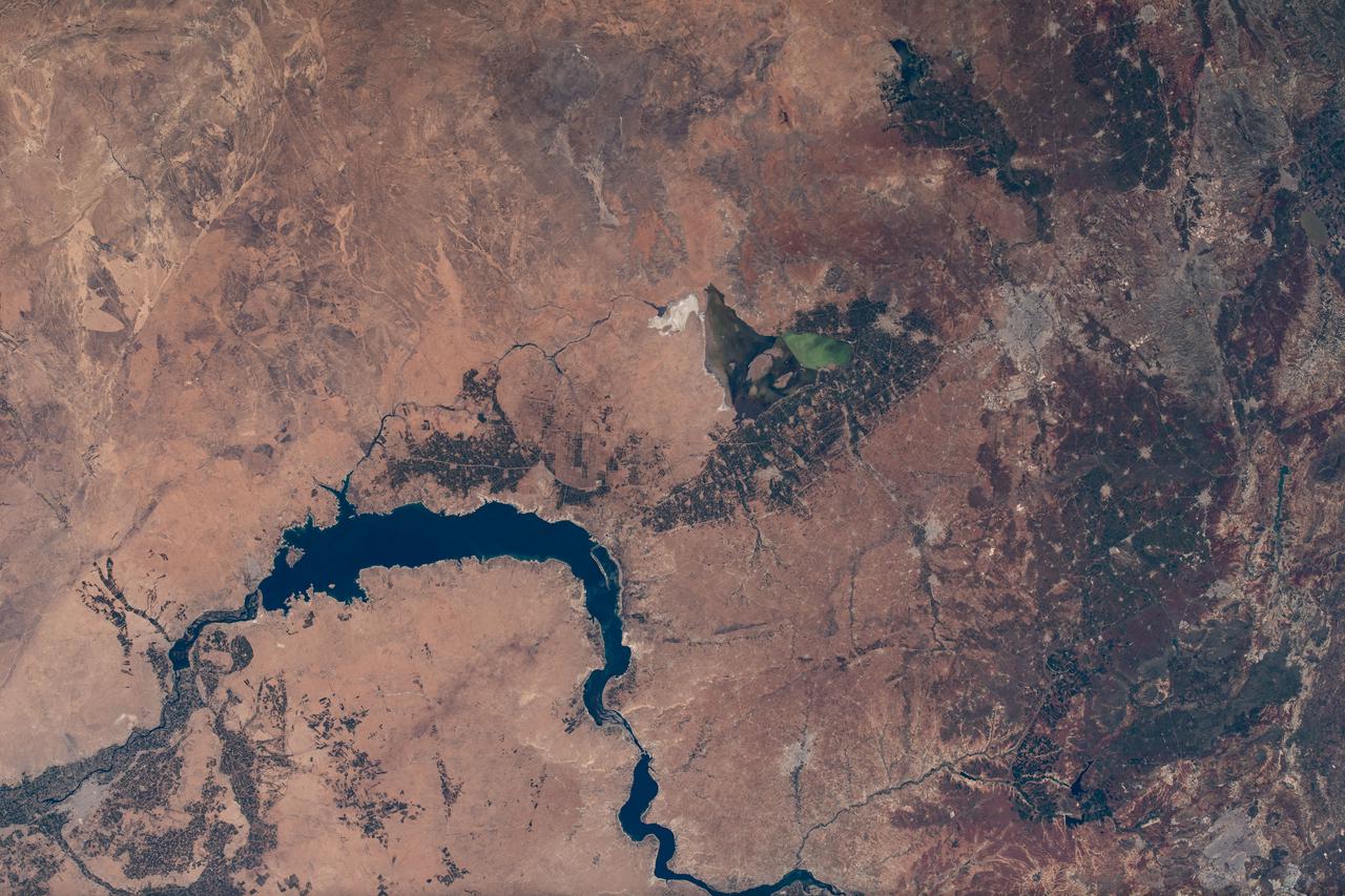 iss065e002136 (April 22, 2021) --- The Euphrates River flows through Lake Assad in Syria in this photograph from the International Space Station as it orbited 263 miles above.