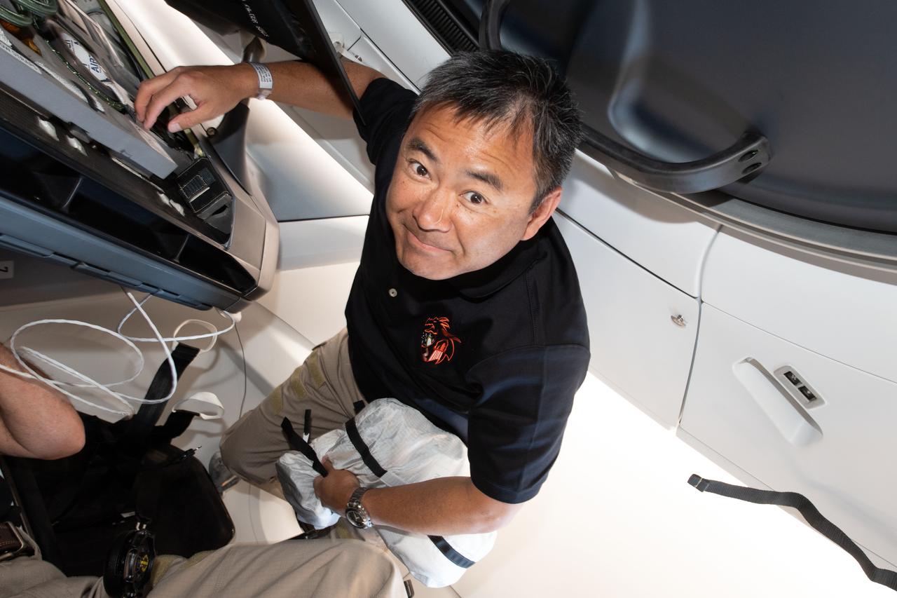 iss065e003579 (April 23, 2021) --- SpaceX Crew-2 Mission Specialist Akihiko Hoshide of the Japan Aerospace Exploration Agency is pictured inside the Crew Dragon Endeavour during its trip to the International Space Station.