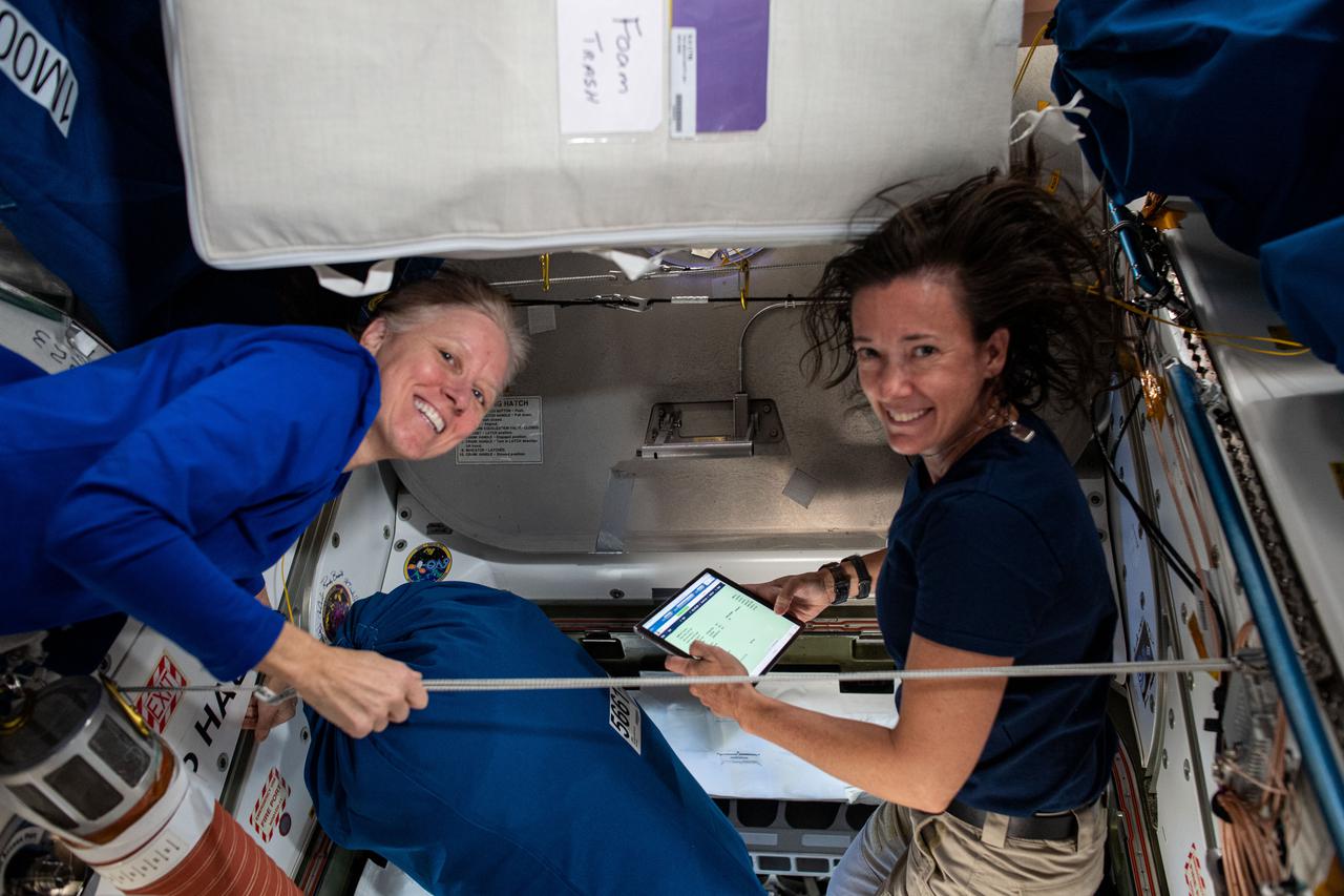 iss065e006538 (April 26, 2021) --- Expedition 65 Flight Engineers Shannon Walker and Megan McArthur, both NASA astronauts, are pictured during crew handover activities aboard the International Space Station. Walker was preparing for her departure with her SpaceX Crew-1 crewmates and helping McArthur, a Crew-2 Pilot, get up to speed with station systems.