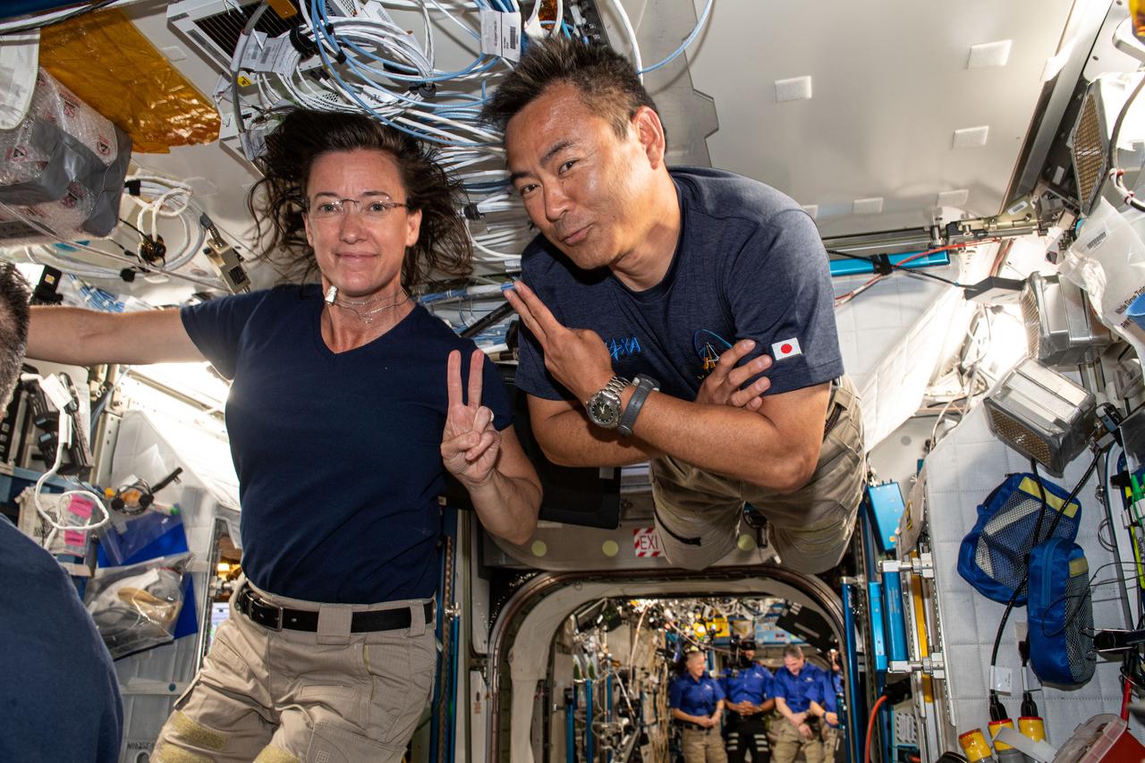 iss065e006604 (April 26, 2021) --- SpaceX Crew-2 Mission Specialists and Expedition 65 Flight Engineers Megan McArthur and Akihiko Hoshide pose for a portrait together as they familiarize themselves with systems aboard the International Space Station.