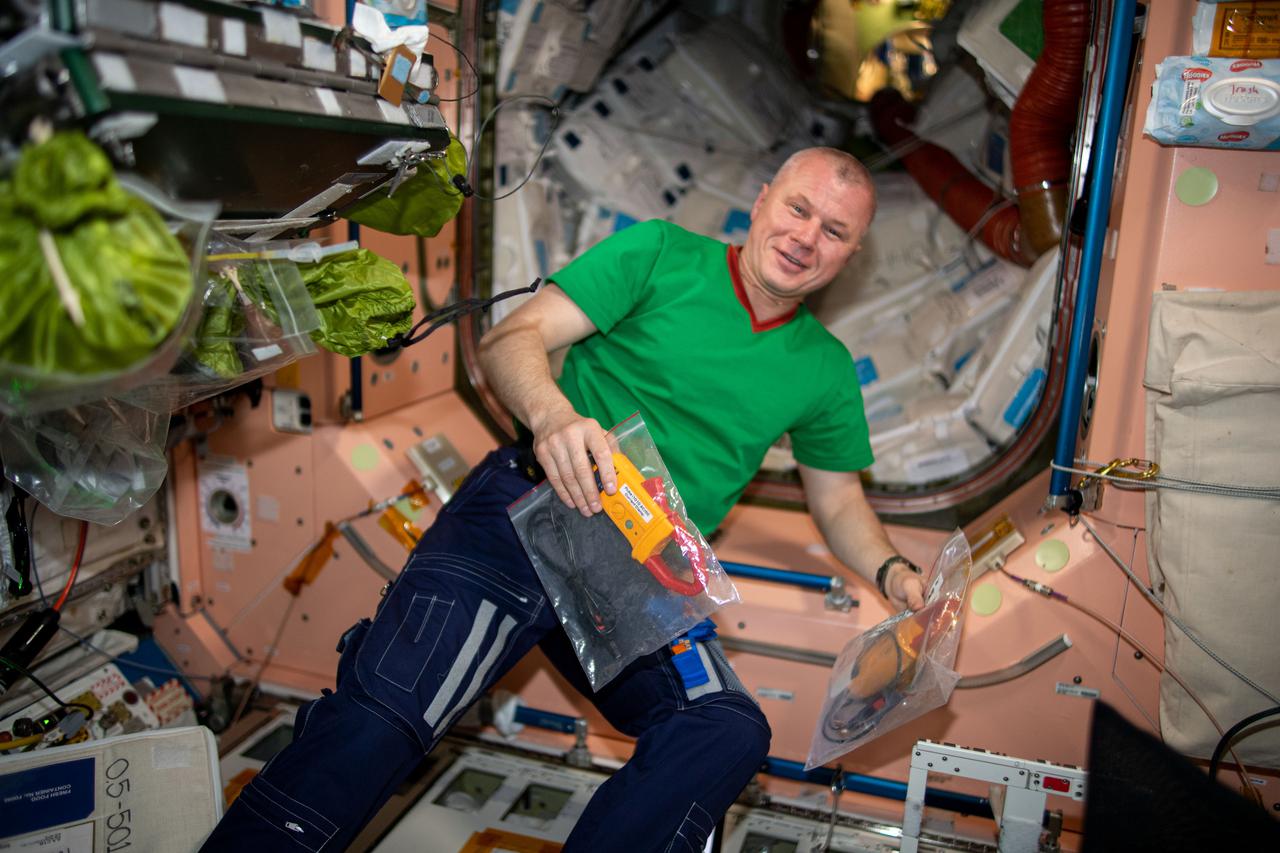 iss065e006630 (April 27, 2021) --- Roscosmos cosmonaut and Expedition 65 Flight Engineer Oleg Novitskiy pauses for a portrait during electrical maintenance work aboard the International Space Station.
