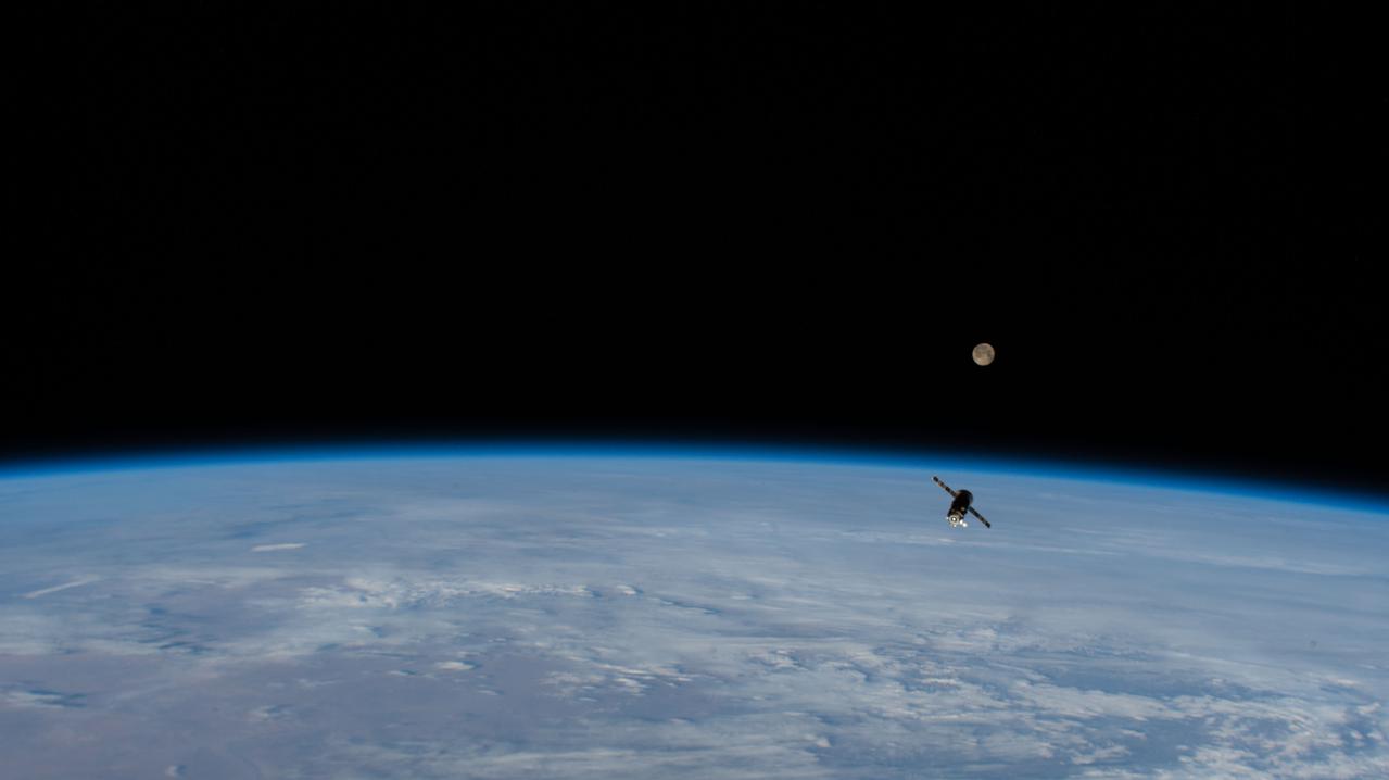 iss065e007768 (April 27, 20211) --- The trash-filled ISS Progress 75 (75P) resupply ship, with the full Moon above the Earth's horizon, is pictured separating from the International Space Station shortly after undocking from the Zvezda service module. The 75P had spent just over a year attached to Zvezda.