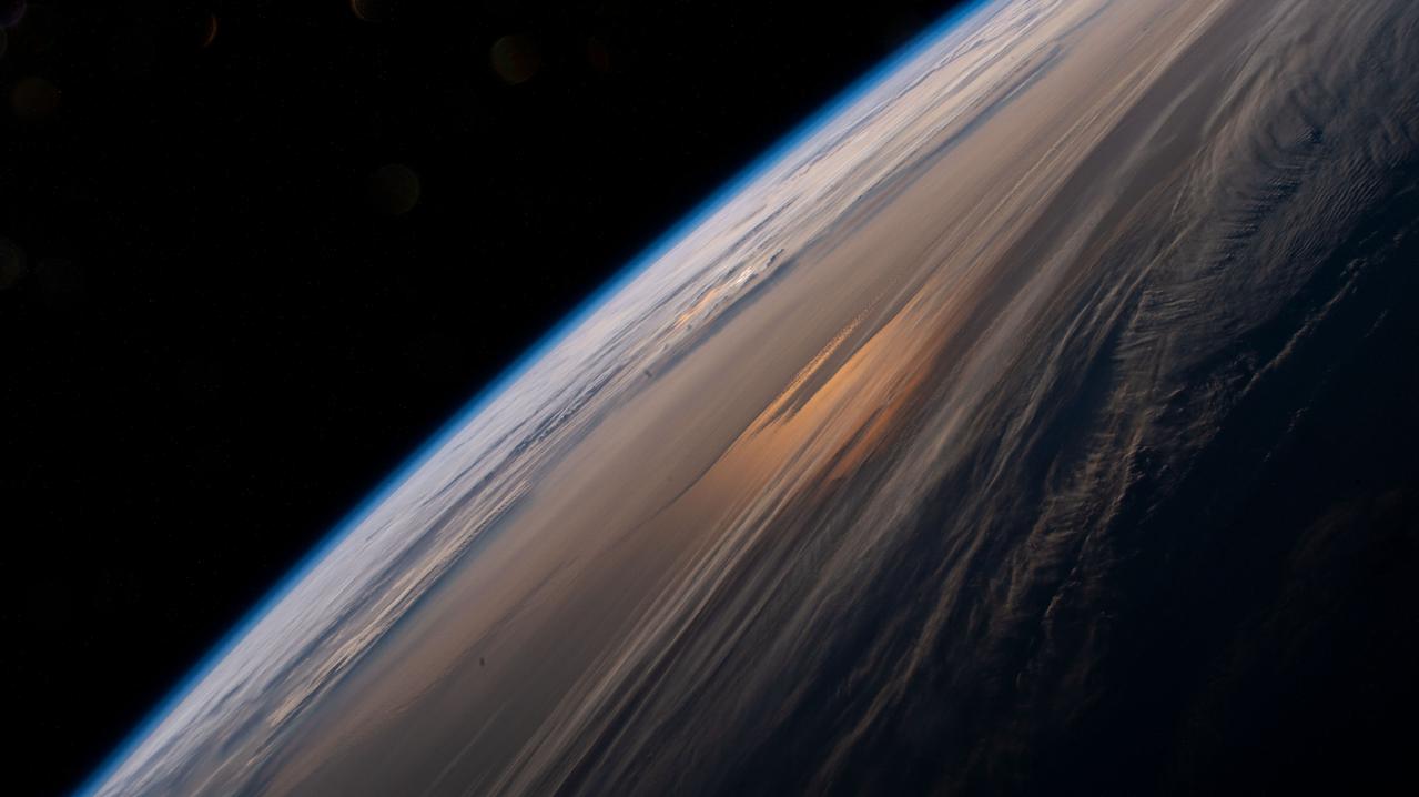 iss065e009308 (April 28, 2021) --- The early morning hues of an orbital sunrise are pictured from the International Space Station as it soared 264 miles above the China-Russia border in far eastern Asia near the the Sea of Japan.