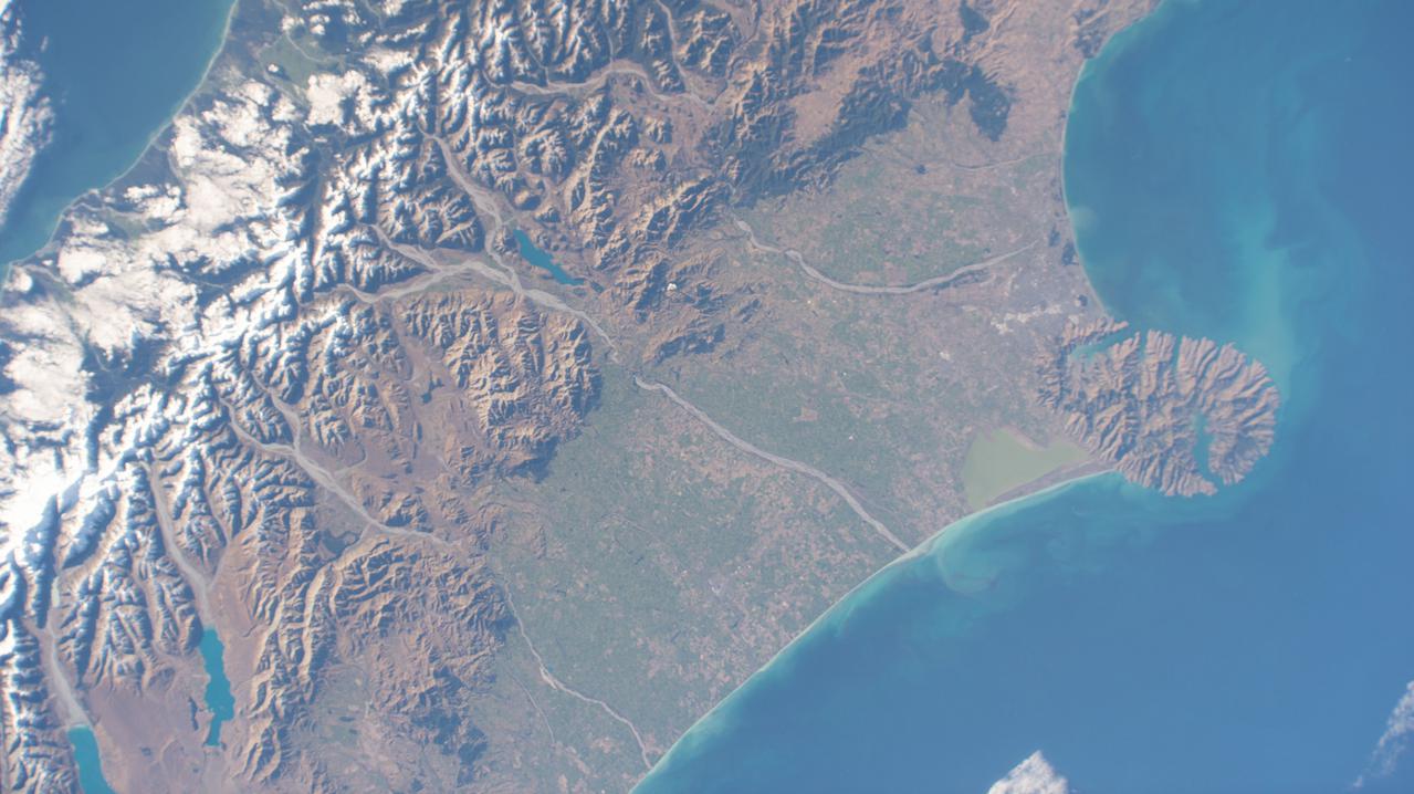 iss065e011342 (May 2, 2021) --- Christchurch, New Zealand, is pictured in between Pigeon Bay and Arthur's Pass National Park as the International Space Station orbited 269 miles above the island nation.
