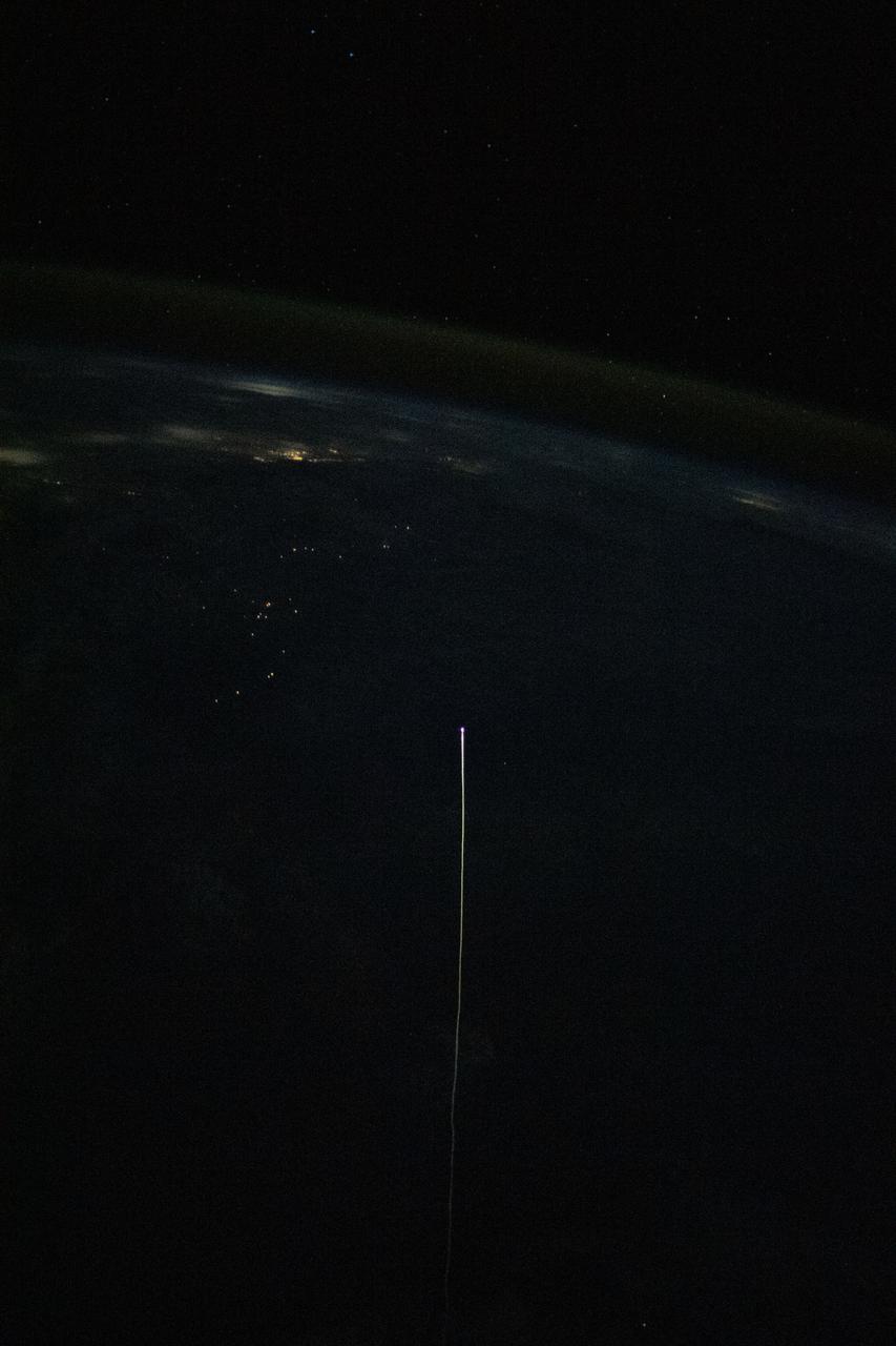 iss065e012241 (May 2, 2021) --- The SpaceX Crew Dragon Resilience is pictured from the International Space Station reentering Earth's atmosphere. Resilience, with its protective heat shield, reached the atmosphere at over 17,000 miles per hour experiencing friction and extreme heat creating a visible plasma trail streaming behind it. Astronauts Michael Hopkins, Victor Glover, Shannon Walker and Soichi Noguchi would safely parachute to a splashdown inside Resilience a few minutes later in the Gulf of Mexico off the coast of Panama City, Florida.