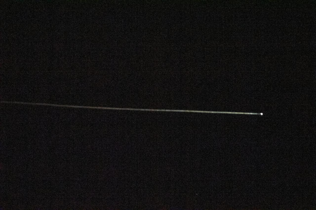 iss065e012568 (May 2, 2021) --- The SpaceX Crew Dragon Resilience is pictured from the International Space Station reentering Earth's atmosphere. Resilience, with its protective heat shield, reached the atmosphere at over 17,000 miles per hour experiencing friction and extreme heat creating a visible plasma trail streaming behind it. Astronauts Michael Hopkins, Victor Glover, Shannon Walker and Soichi Noguchi would safely parachute to a splashdown inside Resilience a few minutes later in the Gulf of Mexico off the coast of Panama City, Florida.