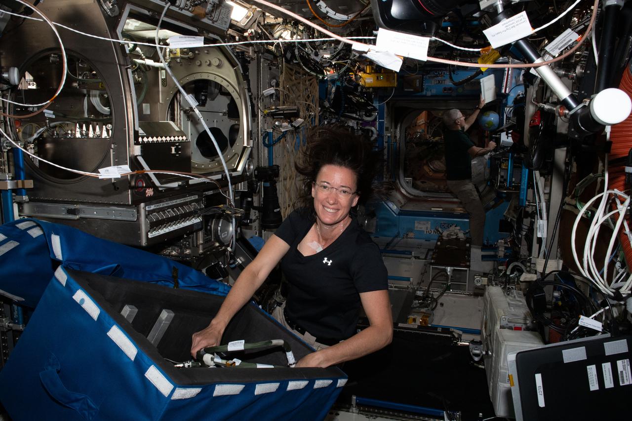 iss065e012827 (May 3, 2021) --- NASA astronaut and Expedition 65 Flight Engineer Megan McArthur stows science hardware and reconfigures the Microgravity Science Glovebox inside the International Space Station's U.S. Destiny laboratory module.