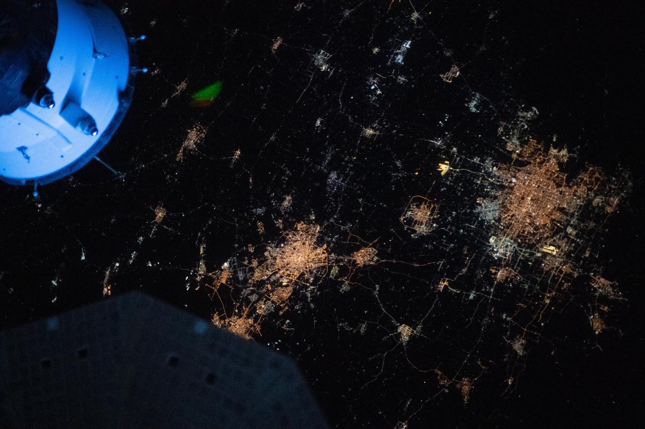 iss065e013034 (May 1, 2021) --- The night lights of Beijing and Tianjin in China are pictured from the International Space Station as it orbited 264 miles above the Asian continent near the Yellow Sea.