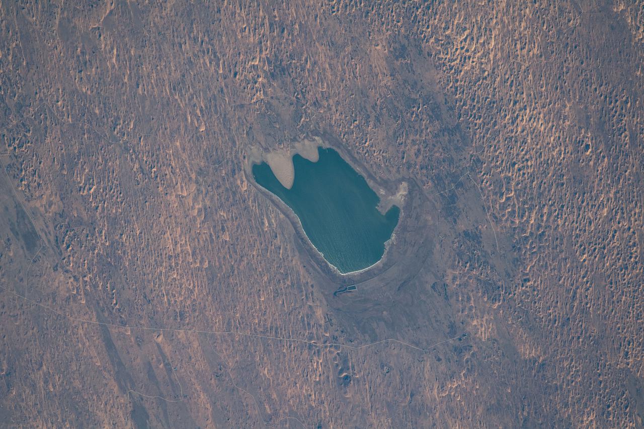 iss065e023073 (May 6, 2021) --- A small lake is pictured in Inner Mongolia, China, as the International Space Station orbited 264 miles above.