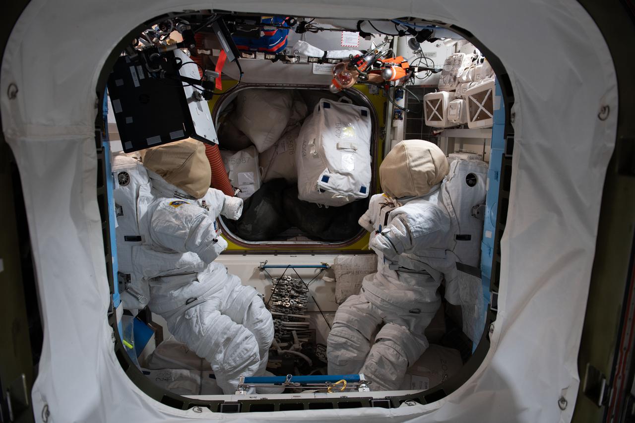 iss065e026376 (May 5, 2021) --- Two U.S. spacesuits are pictured inside the International Space Station's Quest airlock where spacewalks are staged.