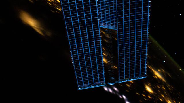 NASA image: Night lights and solar arrays