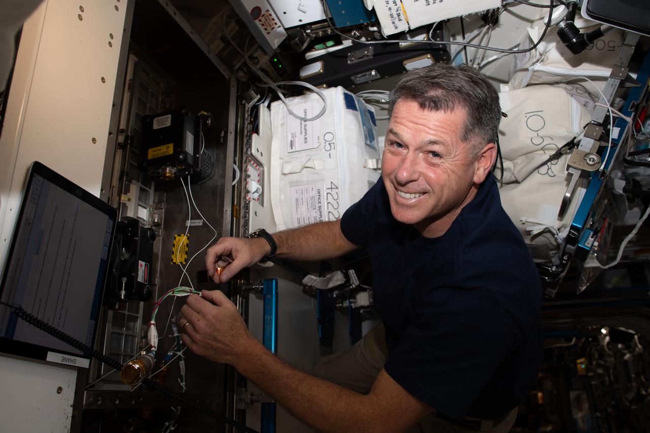 iss065e045733 (May 14, 2021) --- NASA astronaut and Expedition 65 Flight Engineer Shane Kimbrough relocates smoke detectors inside the International Space Station's Harmony module.