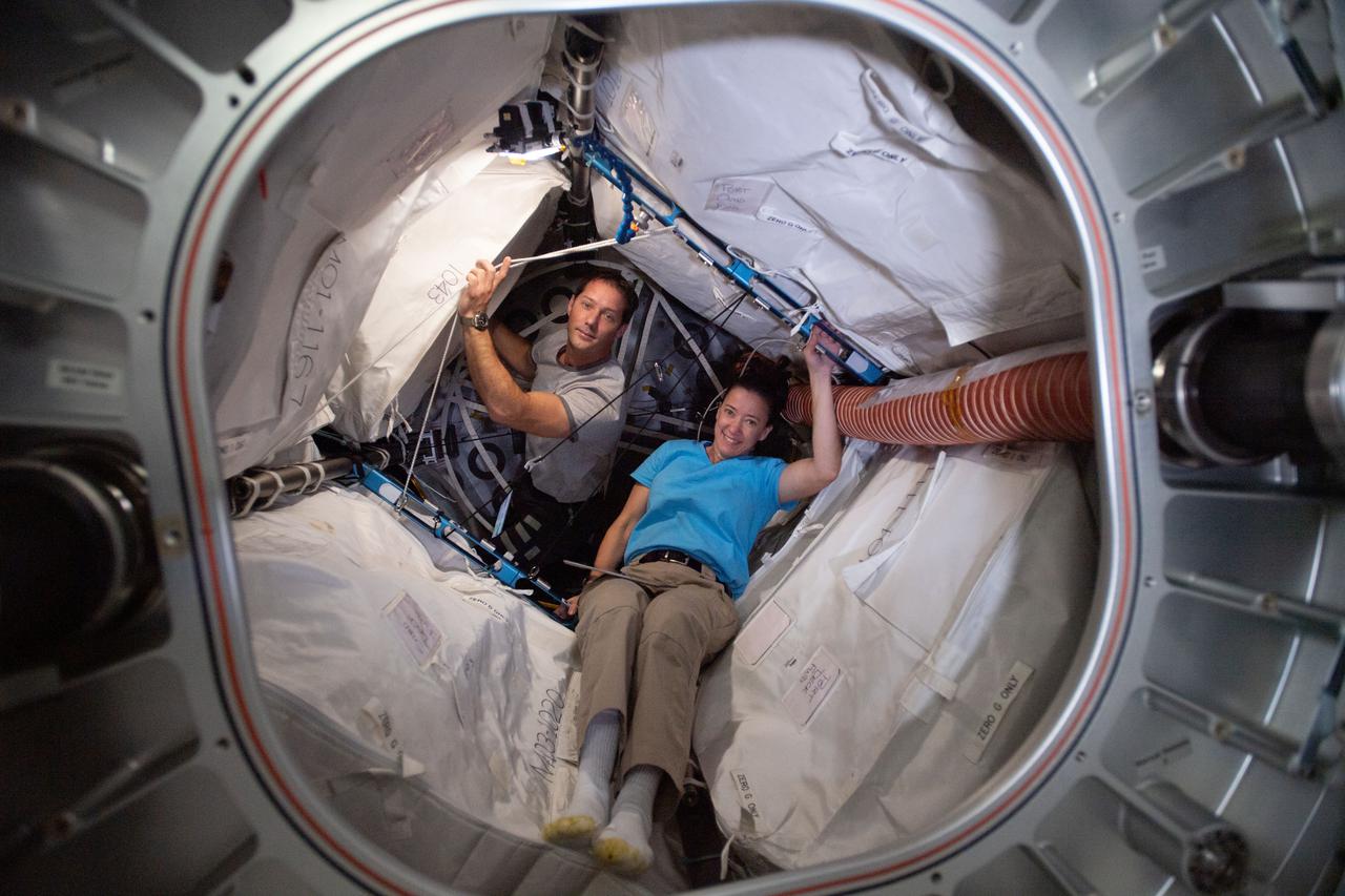 iss065e045911 (May 17, 2021) --- Expedition 65 Flight Engineers Thomas Pesquet from ESA and Megan McArthur from NASA are pictured inside BEAM, the Bigelow Expandable Activity Module,