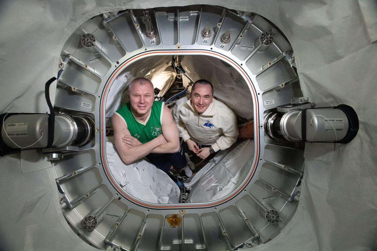 iss065e045917 (May 17, 2021) --- Roscosmos cosmonauts and Expedition 65 Flight Engineers (from left) Oleg Novitskiy and Pyotr Dubrov are pictured inside BEAM, the Bigelow Expandable Activity Module.