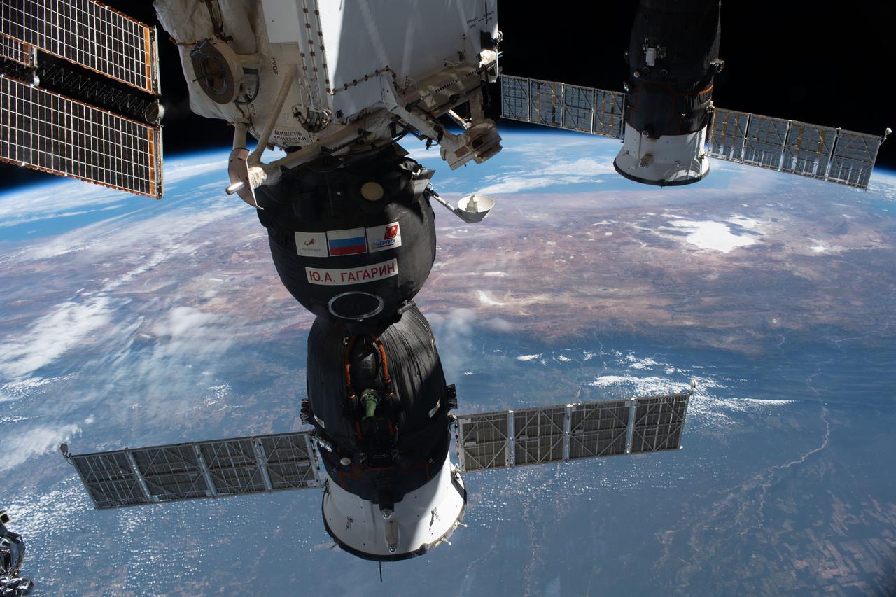 iss065e056881 (May 3, 2021) --- The Soyuz MS-18 crew ship (foreground) and the ISS Progress 77 cargo craft are pictured docked to the International Space Station as it orbited 265 miles above South America.