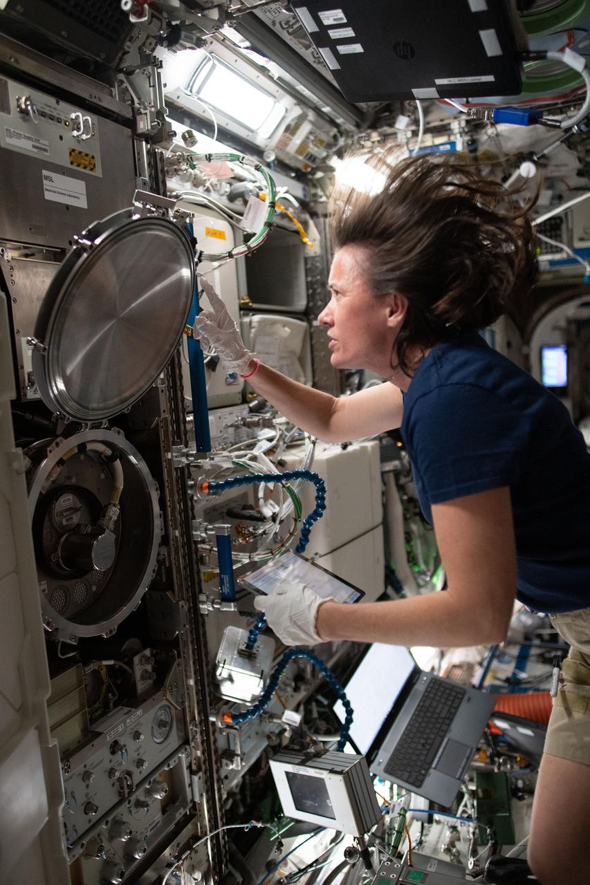 iss065e081297 (May 28, 2021) --- NASA astronaut and Expedition 65 Flight Engineer Megan McArthur swaps sample cartridges inside the Materials Science Laboratory (MSL) rack. The MSL enables observations of microgravity's impact on a variety metals, alloys, polymers, semiconductors, ceramics, crystals, and glasses, to discover new applications for existing materials and new or improved materials.
