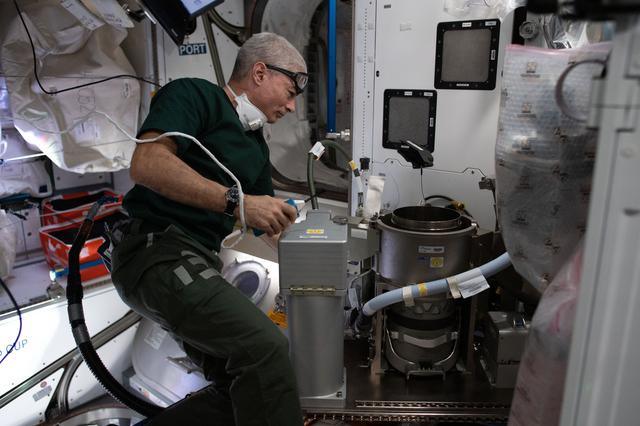 NASA image: Maintenance of new toilet