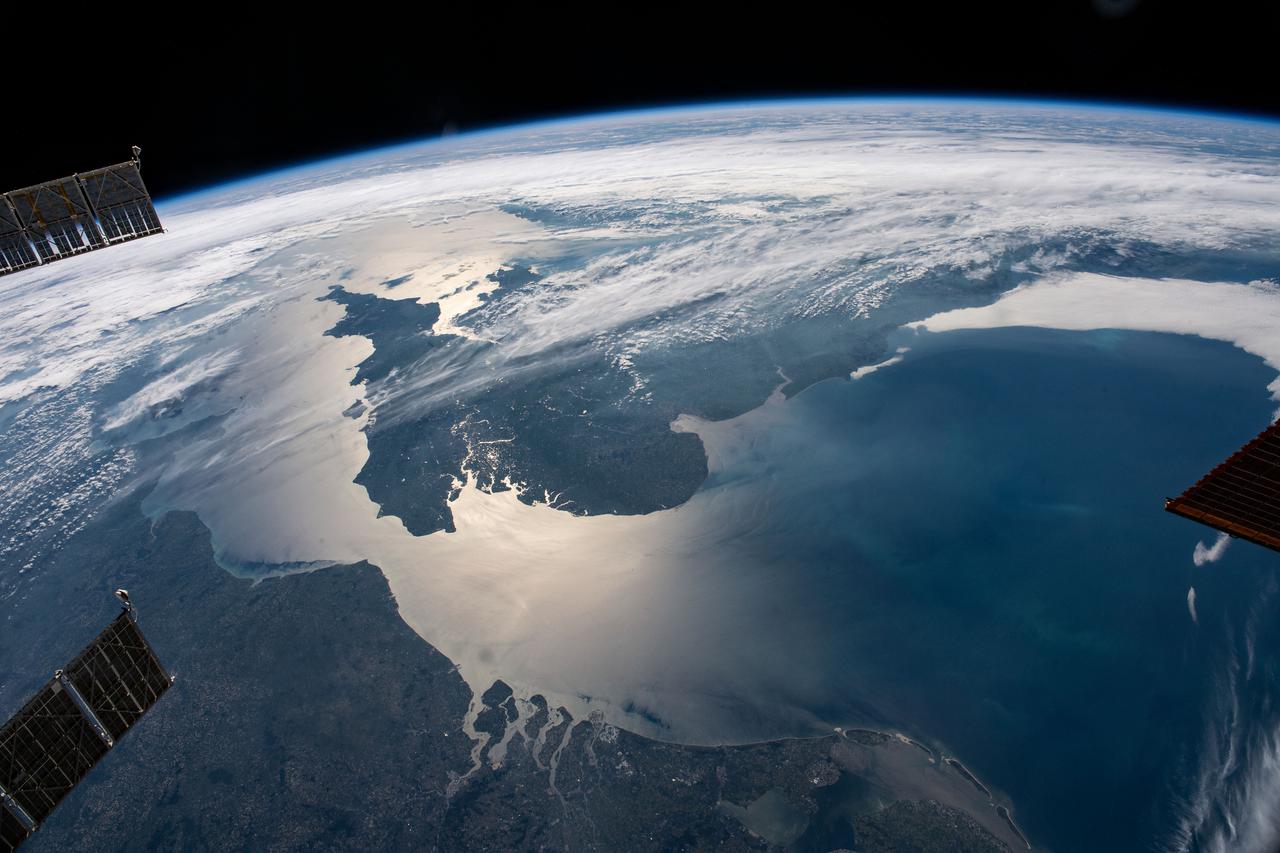 iss065e083895 (June 1, 2021) --- The sun's glint beams across the English Channel and the North Sea in between southern England and the coasts of France, Belgium and The Netherlands, in this photograph from the International Space Station as it orbited 263 miles above.