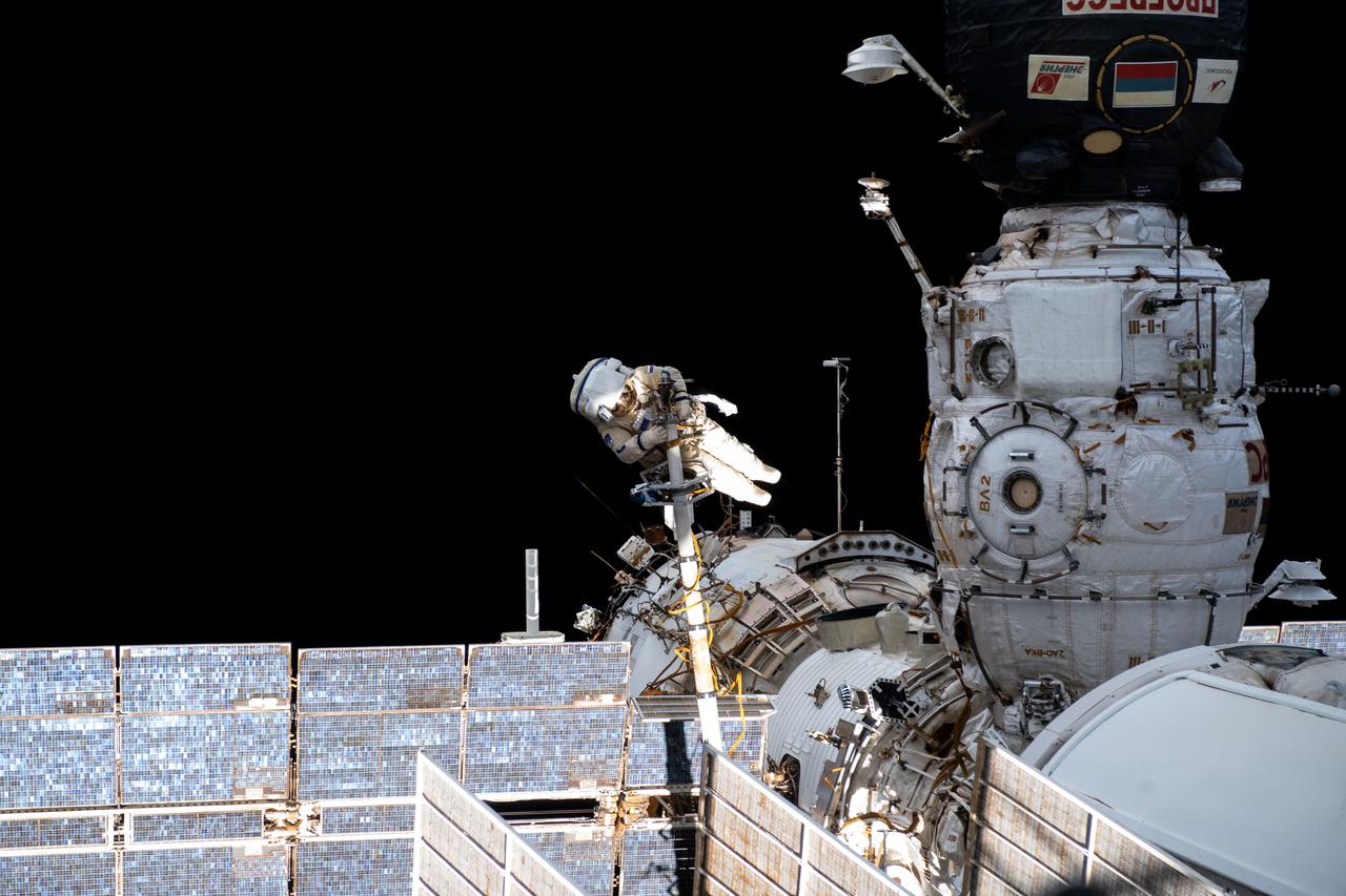 iss065e084961 (June 2, 2021) --- Expedition 65 Flight Engineer and Roscosmos cosmonaut Pyotr Dubrov is pictured during a seven-hour and 19-minute spacewalk to ready the Pirs docking compartment ahead of its upcoming departure. The Nauka multipurpose laboratory module, being launched soon from the Baikonur Cosmodrome in Kazakhstan, will replace Pirs on the Zvezda service module's Earth-facing port.