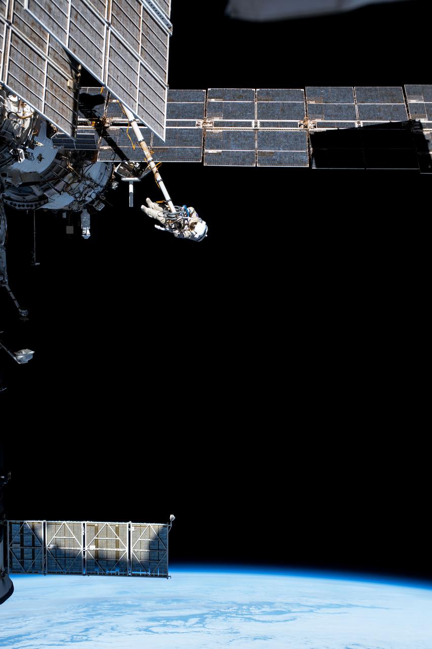 iss065e085003 (June 2, 2021) --- Expedition 65 Flight Engineer and Roscosmos cosmonaut Pyotr Dubrov is pictured during a seven-hour and 19-minute spacewalk to ready the Pirs docking compartment ahead of its upcoming departure. The Nauka multipurpose laboratory module, being launched soon from the Baikonur Cosmodrome in Kazakhstan, will replace Pirs on the Zvezda service module's Earth-facing port.