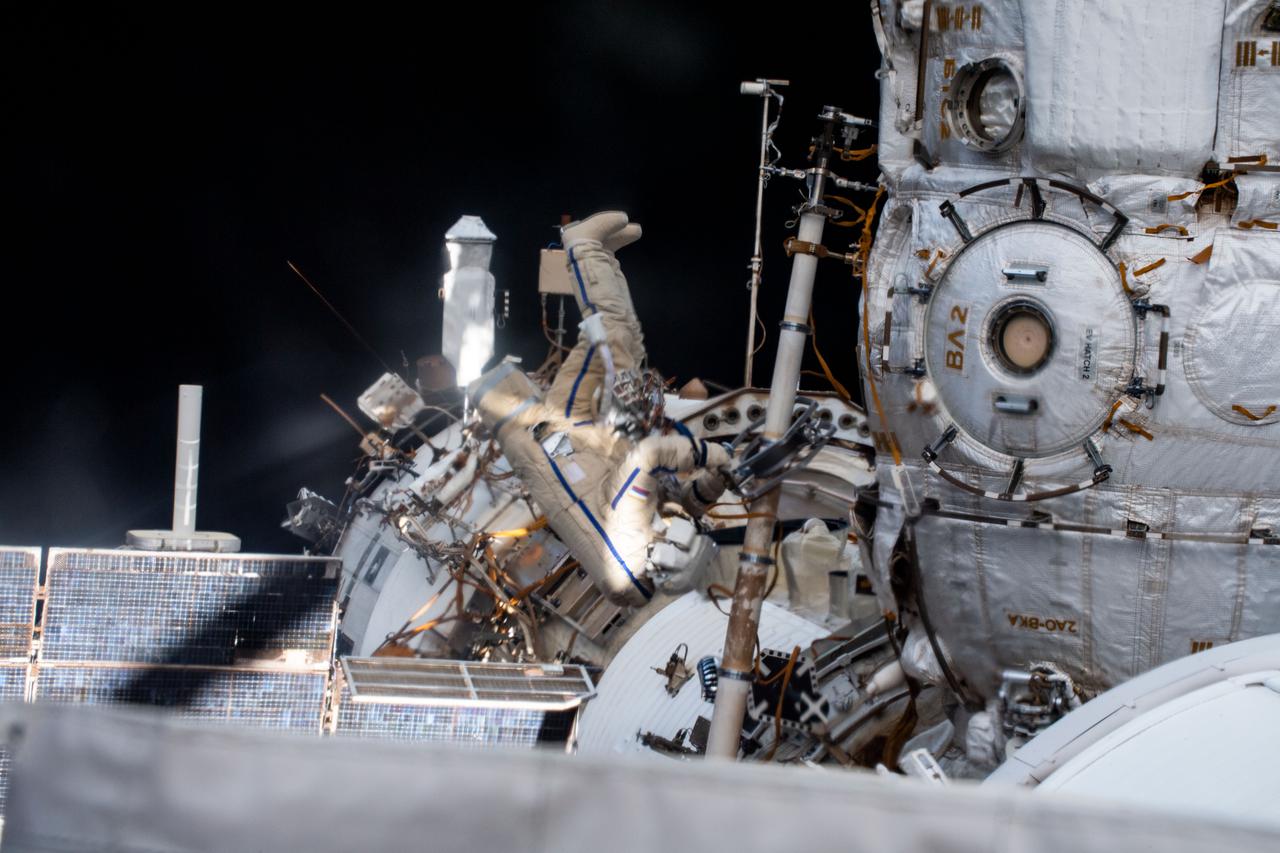 iss065e085105 (June 2, 2021) --- Expedition 65 Flight Engineer and Roscosmos cosmonaut Pyotr Dubrov is pictured during a seven-hour and 19-minute spacewalk to ready the Pirs docking compartment ahead of its upcoming departure. The Nauka multipurpose laboratory module, being launched soon from the Baikonur Cosmodrome in Kazakhstan, will replace Pirs on the Zvezda service module's Earth-facing port.