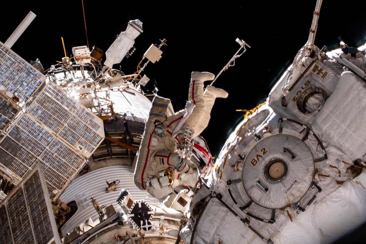iss065e085298 (June 2, 2021) --- Expedition 65 Flight Engineer and Roscosmos cosmonaut Oleg Novitskiy is pictured during a seven-hour and 19-minute spacewalk to ready the Pirs docking compartment ahead of its upcoming departure. The Nauka multipurpose laboratory module, being launched soon from the Baikonur Cosmodrome in Kazakhstan, will replace Pirs on the Zvezda service module's Earth-facing port.
