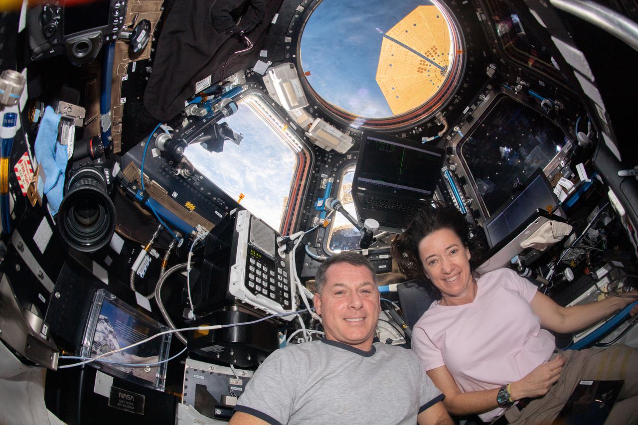 iss065e087513 (June 5, 2021) --- NASA's Expedition 65 Flight Engineers Shane Kimbrough and Megan McArthur are pictured inside the cupola, the International Space Station's "window to the world," monitoring the approach and rendezvous of the SpaceX Cargo Dragon vehicle on the SpaceX CRS-22 mission.