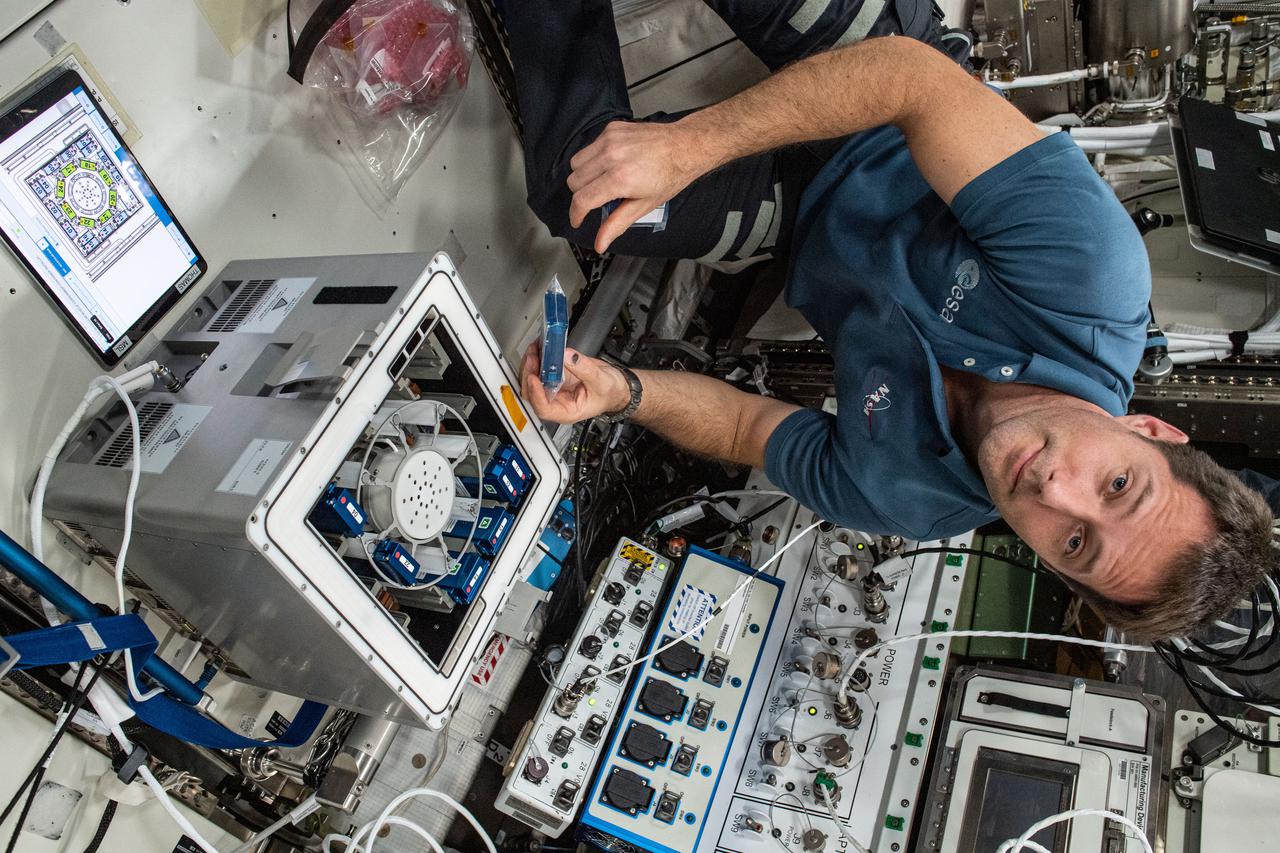 iss065e092410 (June 5, 2021) --- European Space Agency (ESA) astronaut Thomas Pesquet installs the Molecular Muscle Experiment-2 (MME-2) inside the Columbus laboratory module. MME-2 tests a series of drugs to see if they can improve health in space possibly leading to new therapeutic targets for examination on Earth.