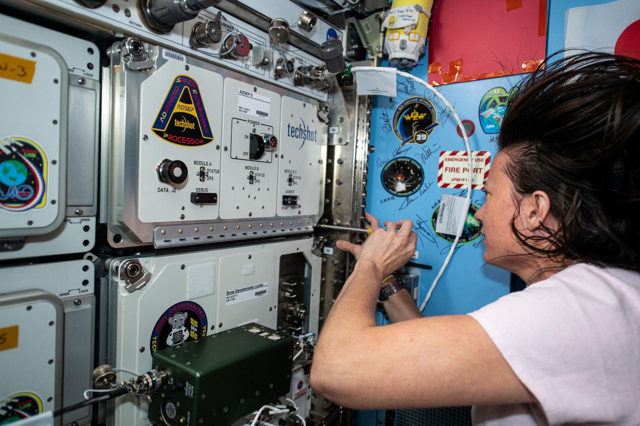 iss065e093508 (June 7, 2021) --- NASA astronaut Megan McArthur installs a new ADSEP-2 (Advanced Space Experiment Processor-2) containing ADSEP-UMAMI samples inside the Kibo laboratory module aboard the International Space Station (ISS).  The Understanding of Microgravity on Animal-Microbe Interactions (UMAMI) investigation examines the effects of spaceflight on the molecular and chemical interactions between beneficial microbes and their animal hosts.  The ADSEP-2 facility supports observations of biological or physical samples and can also be operated aboard the Cargo Dragon and Northrop Grumman Cygnus resupply ships.