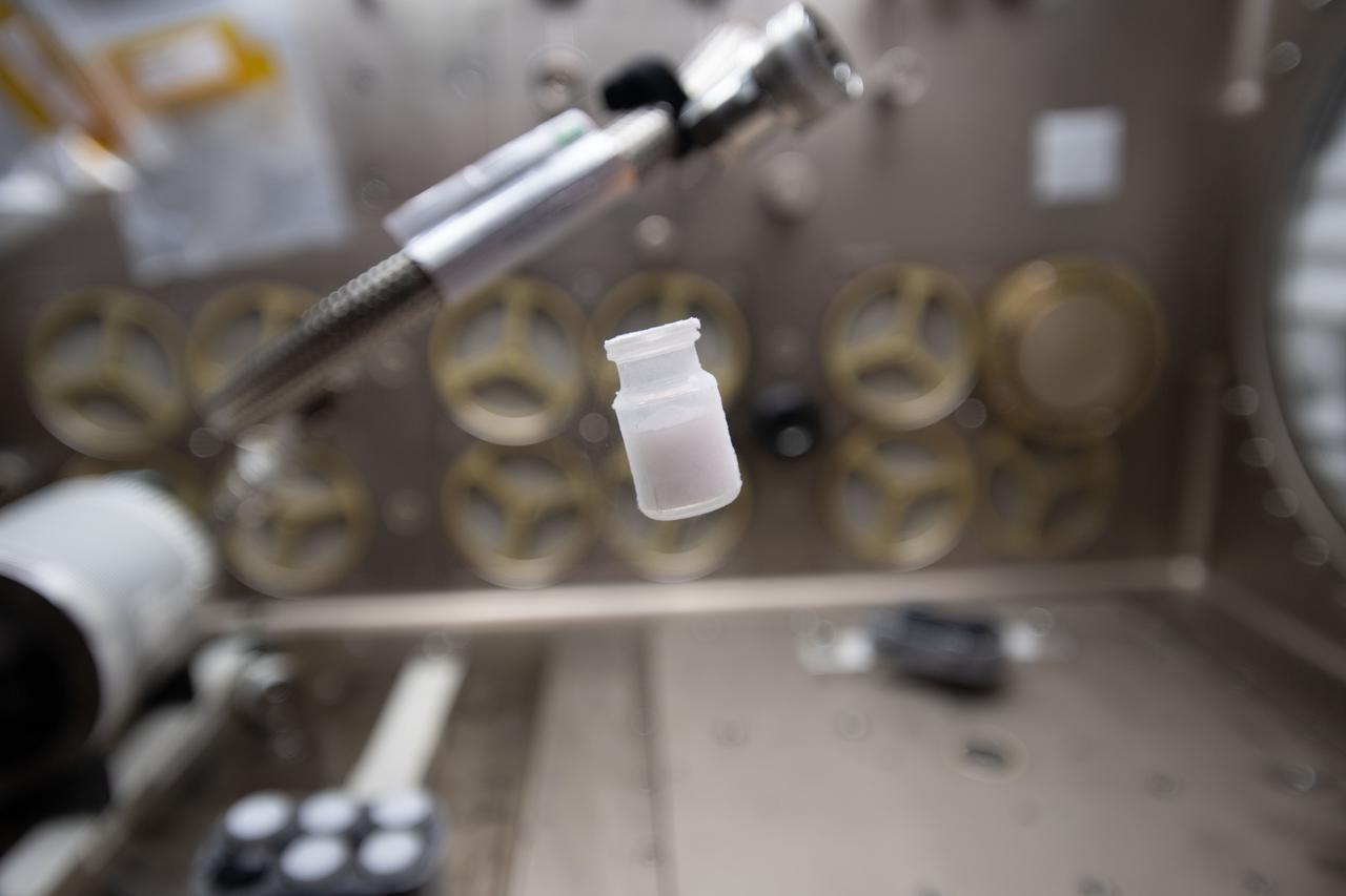 iss065e094051 (6/9/2021) --- A view of a vial from the Lyophilization-2 investigation aboard the International Space Station (ISS). Lyophilization-2 in Microgravity (Lyophilization-2) examines gravity’s effects on freeze-dried materials. Lyophilization, or freeze-drying, is a common method for formulating pharmaceuticals with improved chemical and physical stability.