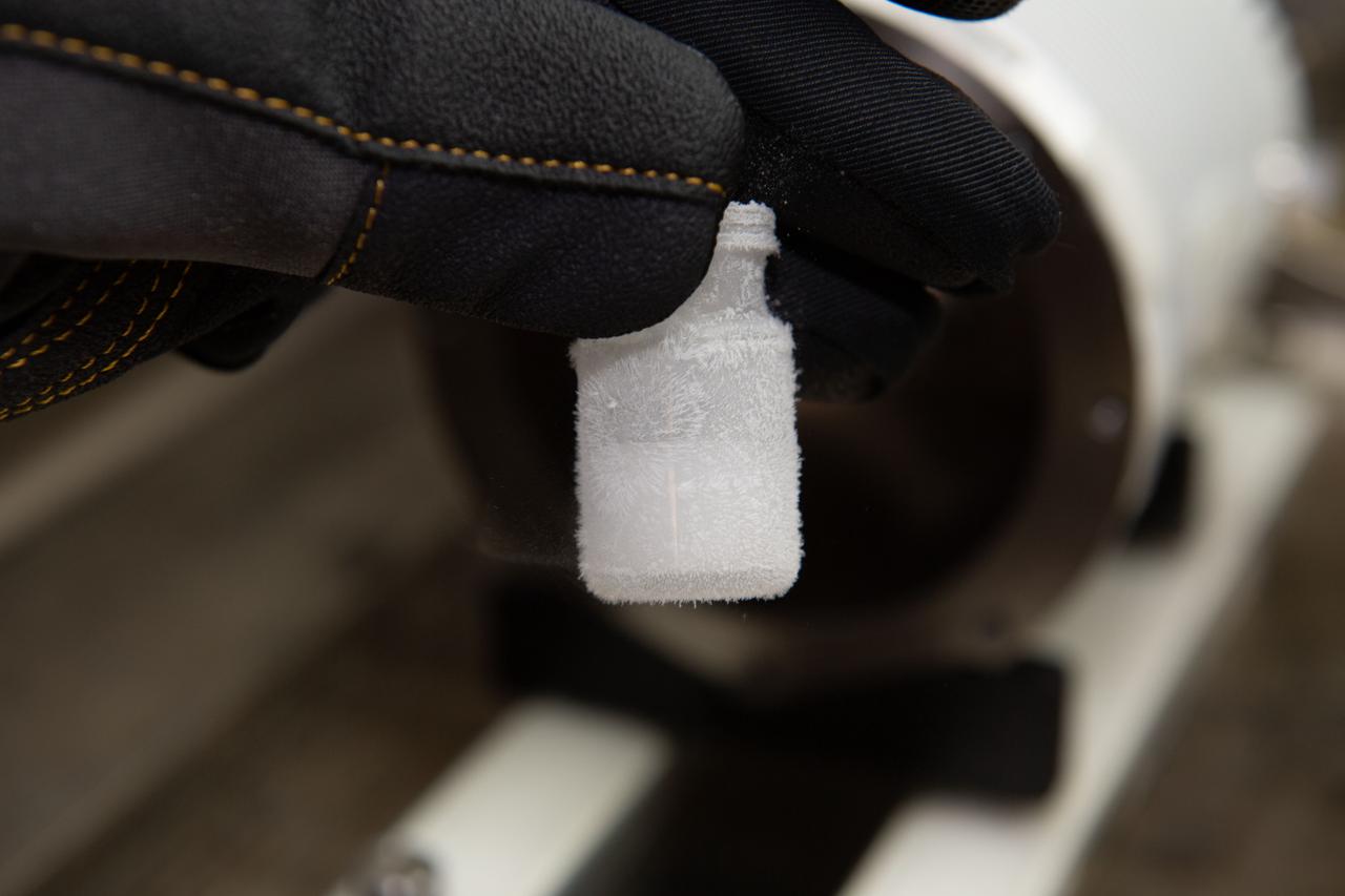 iss065e094345 (6/10/2021) --- A view of a vial from the Lyophilization-2 investigation aboard the International Space Station (ISS). Lyophilization-2 in Microgravity (Lyophilization-2) examines gravity’s effects on freeze-dried materials. Lyophilization, or freeze-drying, is a common method for formulating pharmaceuticals with improved chemical and physical stability.