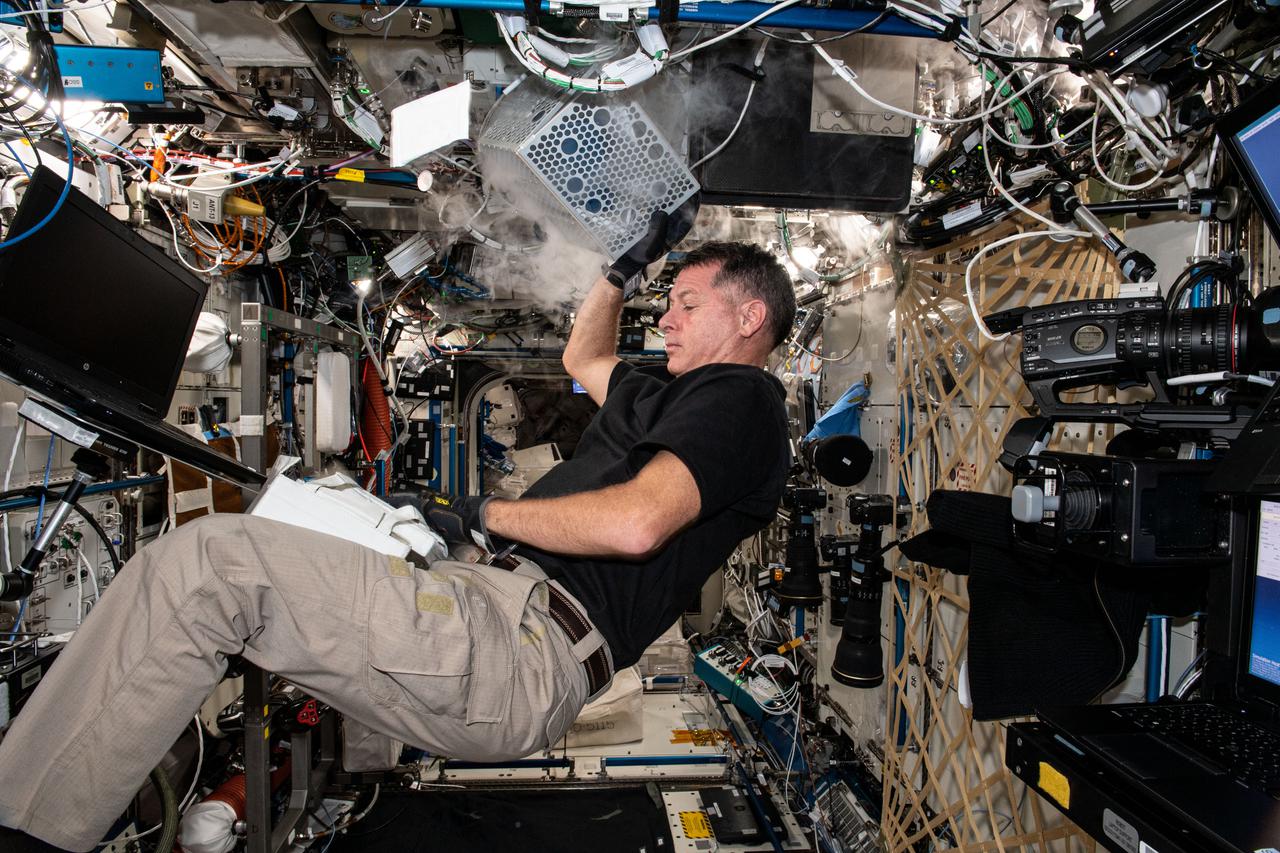 iss065e095956 (June 11, 2021) --- NASA astronaut and Expedition 65 Flight Engineer Shane Kimbrough services hardware inside an ultra-cold science freezer, also known as General Laboratory Active Cryogenic International Space Station (ISS) Experiment Refrigerator, or GLACIER.