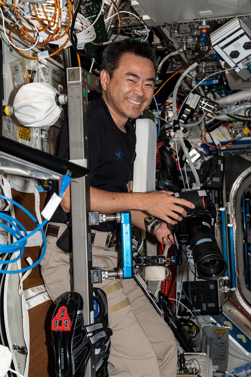 iss065e144343 (June 23, 2021) --- Expedition 65 Commander Akihiko Hoshide of the Japan Aerospace Exploration Agency is pictured during photography activities aboard the International Space Station.