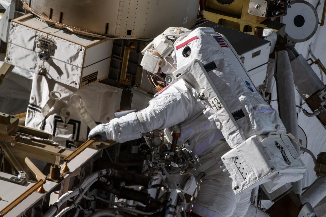 iss065e145037 (June 25, 2021) --- Spacewalker Thomas Pesquet of ESA (European Space Agency) works to complete the installation of the second roll out solar array on the International Space Station's Port-6 truss structure.