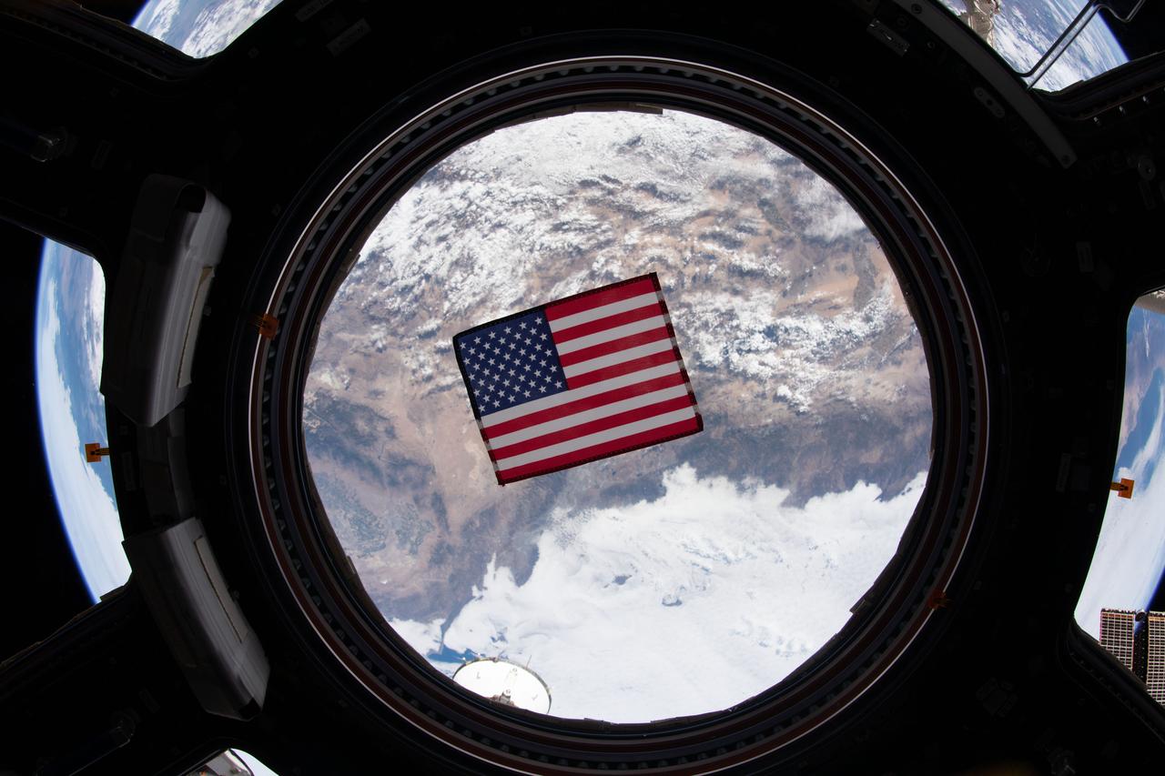 View of a small U.S. flag floating in the Cupola window