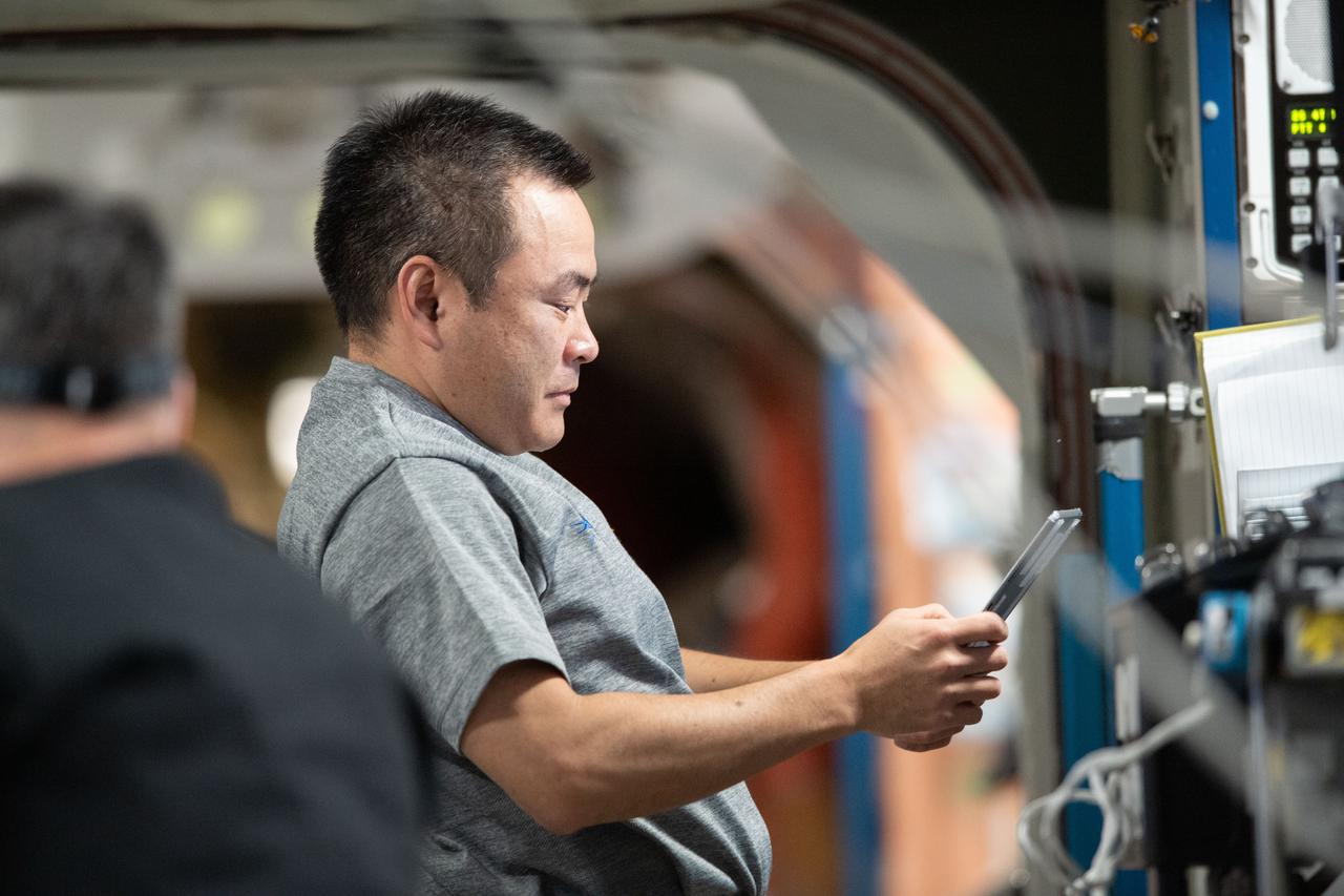 iss065e158464 (July 8, 2021) --- Expedition 65 Commander Akihiko Hoshide of the Japan Aerospace Exploration Agency reviews procedures on a computer tablet for the InSPACE-4 physics study that explores the ability to harness nanoparticles to fabricate new and advanced materials.