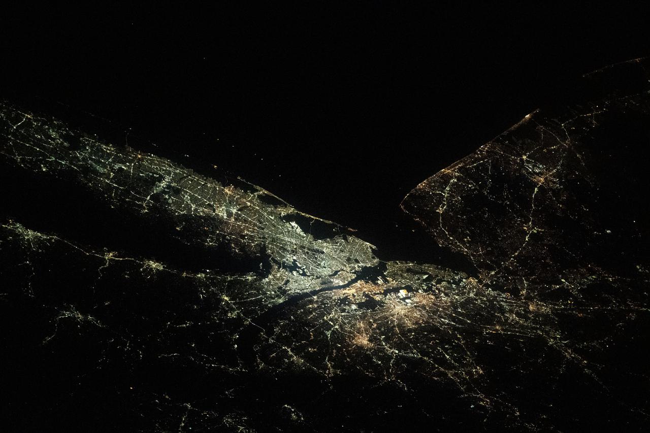 iss065e214158 (Aug. 1, 2021) --- New York City and its suburbs light up this portion of the northeastern U.S. coast of the United States in this oblique view view from the International Space Station.