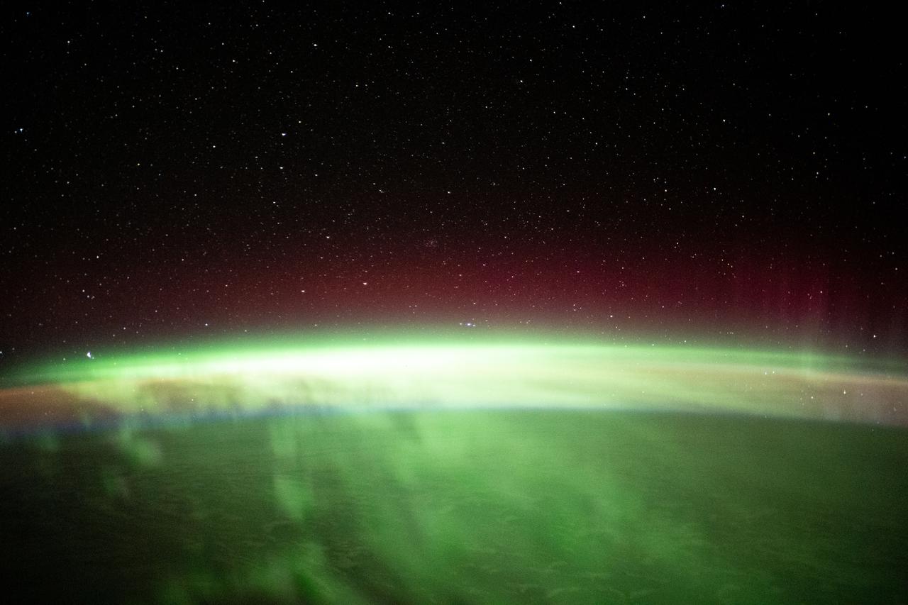 iss065e214235 (Aug. 2, 2021) --- The aurora australis streams across the Earth's atmosphere as the International Space Station orbited 271 miles above the southern Indian Ocean in between Asia and Antarctica.