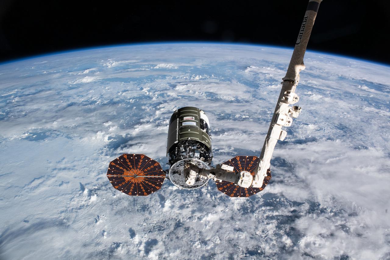 iss065e241374 (Aug. 12, 2021) --- Northrop Grumman's Cygnus space freighter is pictured shortly after it was captured in the grips of the Canadarm2 robotic arm operated NASA Flight Engineer Megan McArthur. The International Space Station was orbiting 263 miles above China at the time of this photograph.