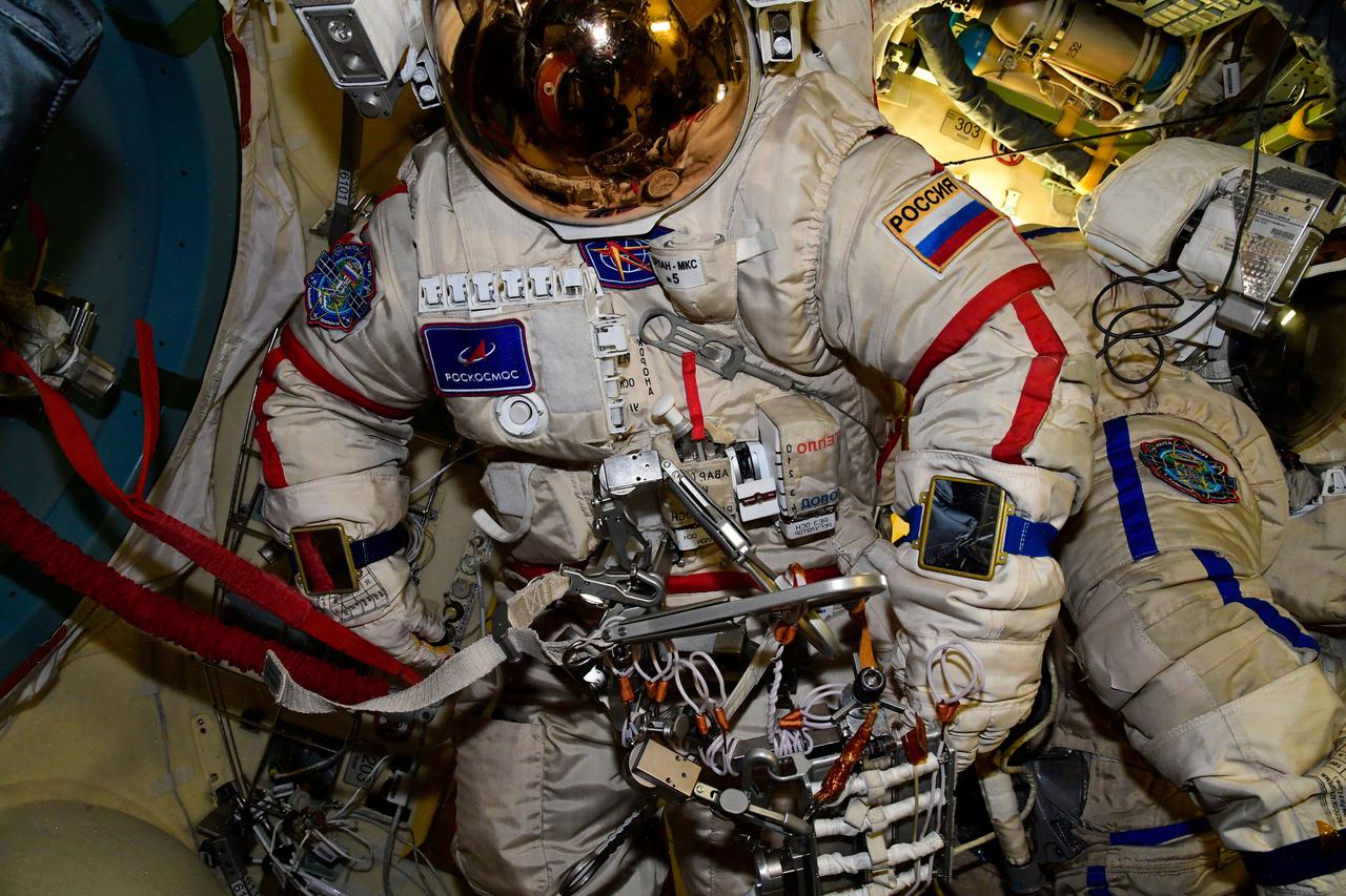 iss065e317984 (Aug. 27, 2021) --- An empty Russian Orlan spacesuit is pictured inside the International Space Station's Poisk module. Expedition 65 Flight Engineer Oleg Novitskiy of Roscosmos would go on to wear the spacesuit during a pair of spacewalks on Sept. 3 and Sept. 9 with fellow Flight Engineer Pyotr Dubrov.
