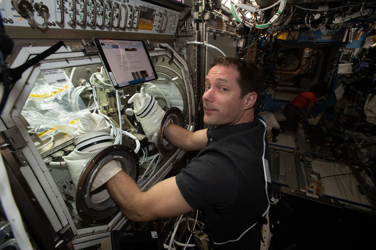 iss065e319336 (Aug. 27, 2021) --- Expedition 65 Flight Engineer Thomas Pesquet of ESA (European Space Agency) works on the Ring-Sheared Drop experiment inside the U.S. Destiny laboratory module's Microgravity Science Glovebox. Results from the fluid physics study could contribute to a better understanding of neurodegenerative diseases such as Alzheimer’s as well as the development of advanced materials.